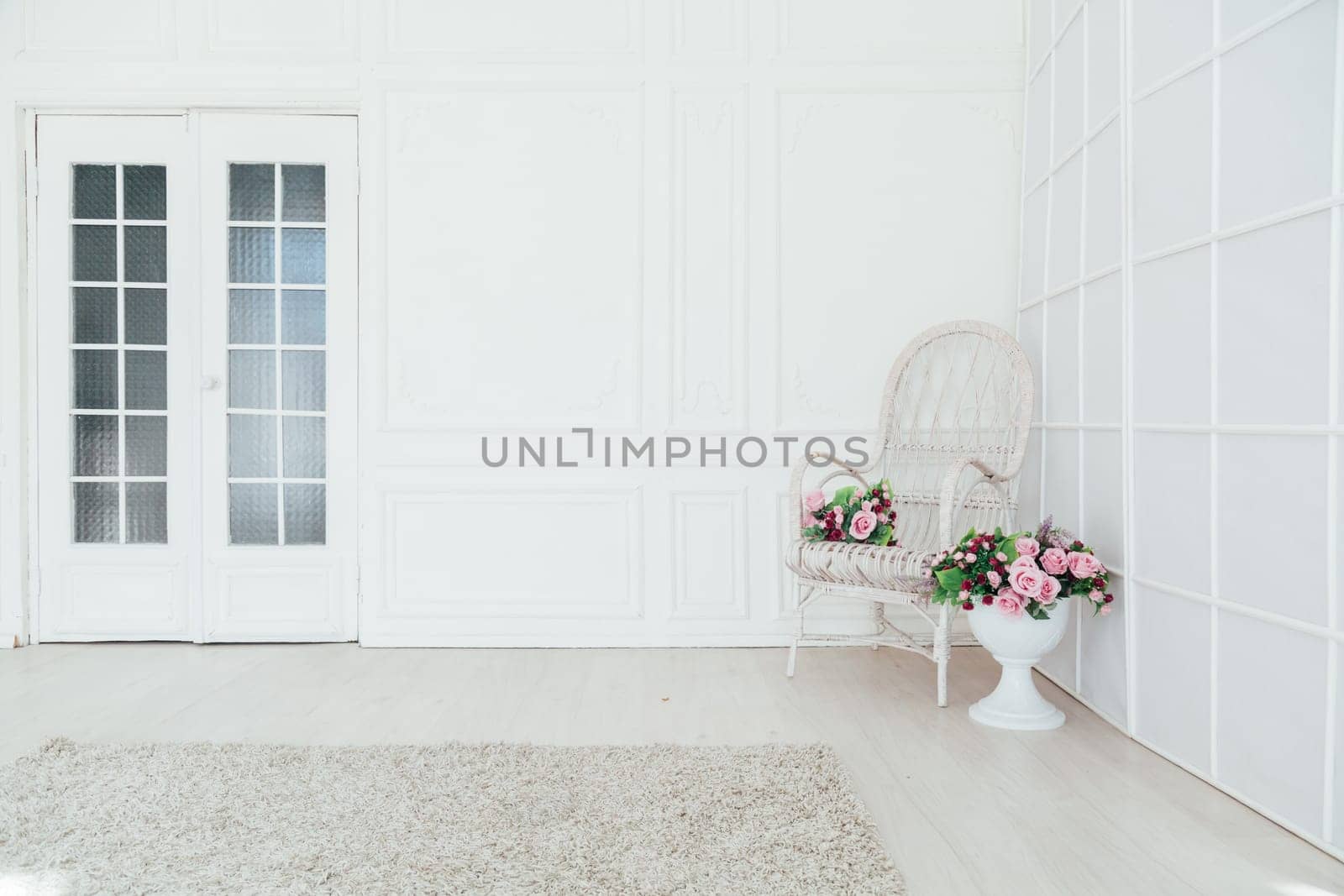 white vintage chair in the interior of an empty white room by Simakov