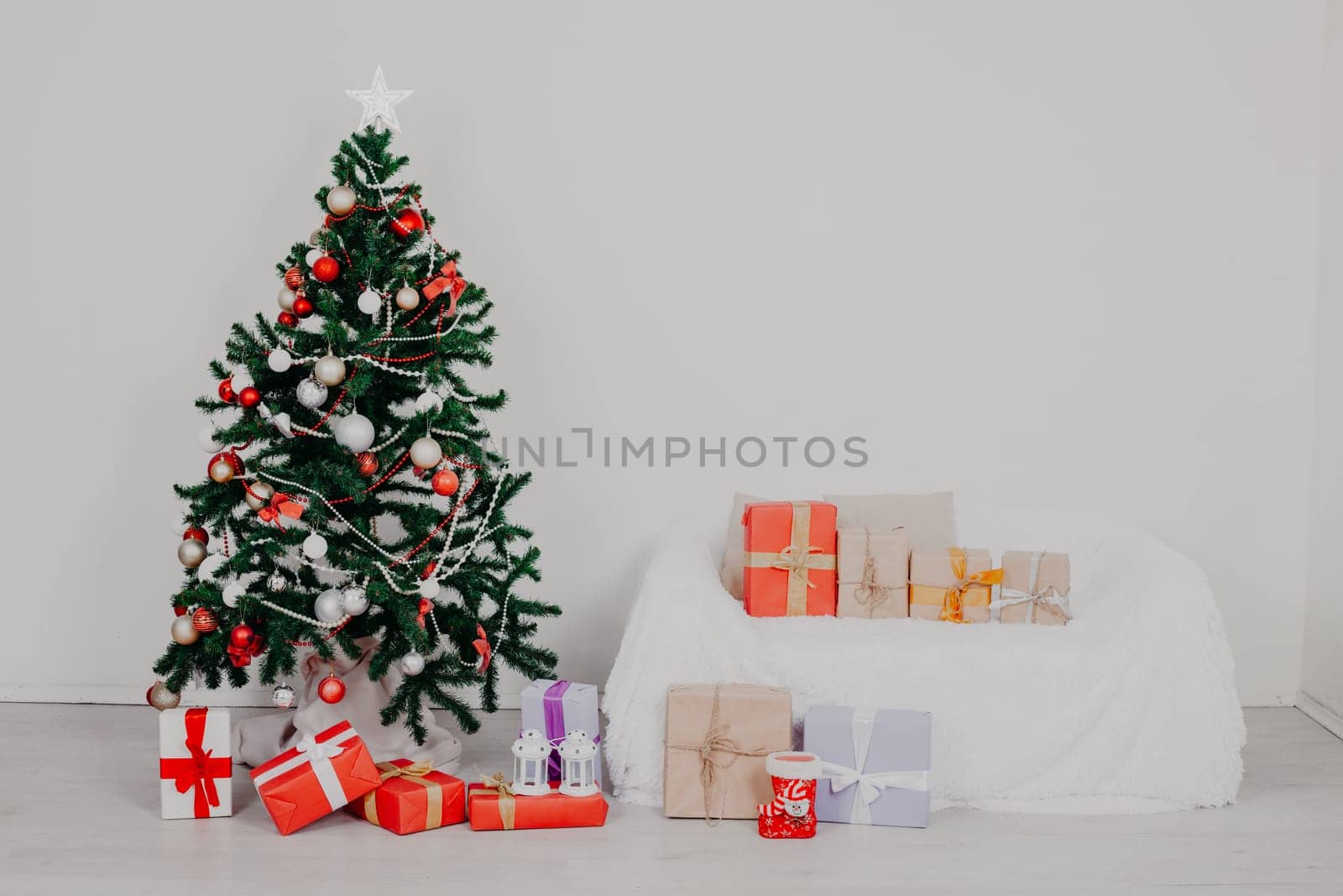 Christmas tree in the room with Christmas decorations and gifts toys winter