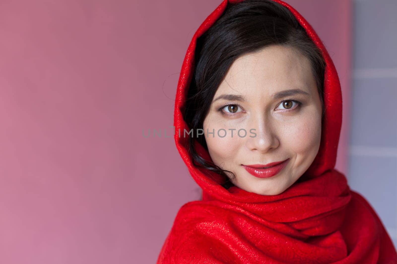 portrait of a beautiful Woman Muslim woman with a red handkerchief on her head