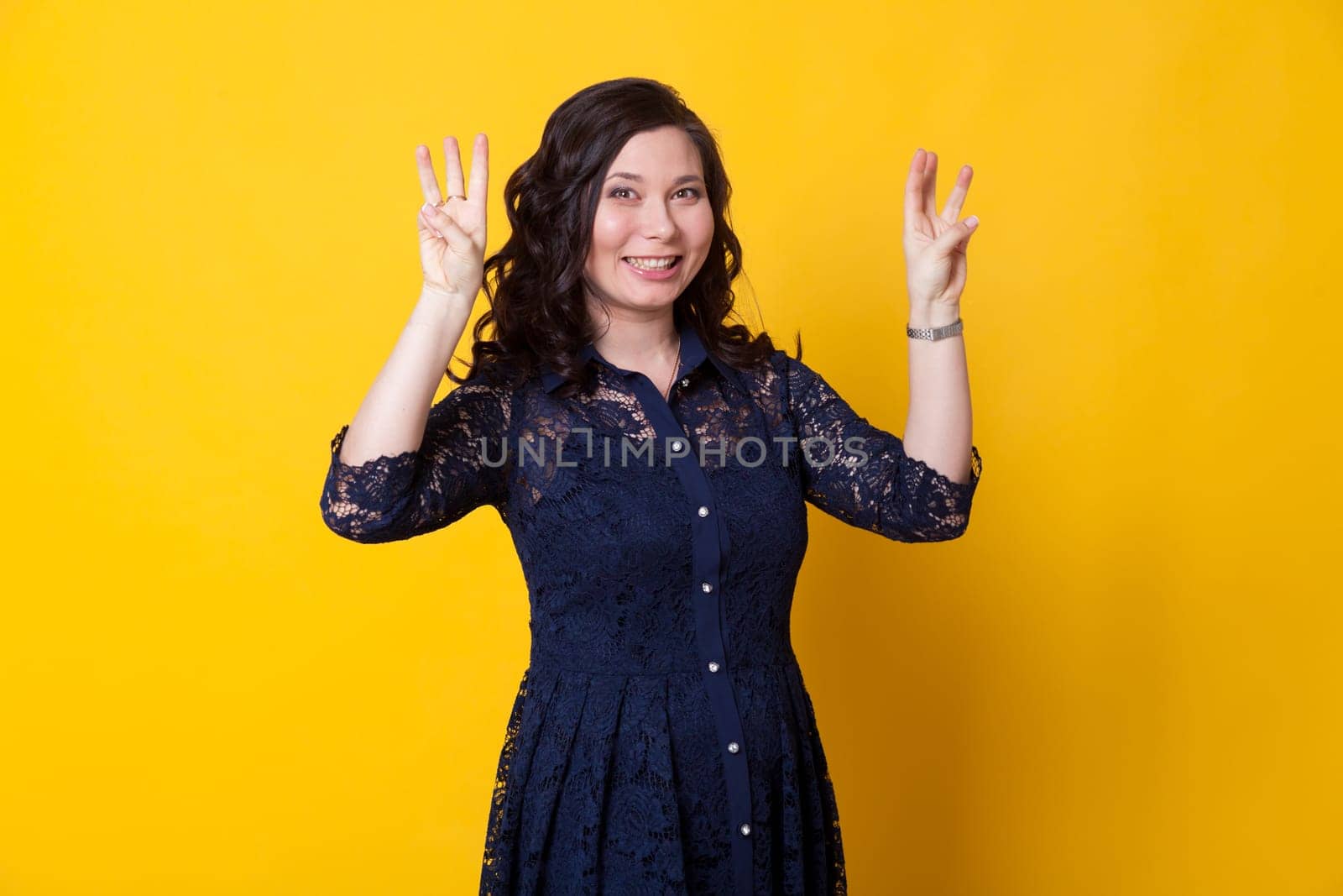 Beautiful Asian woman shows 6 fingers on her hand by Simakov