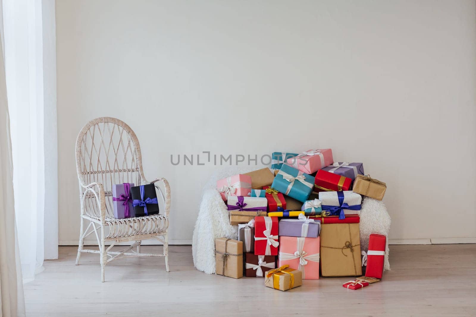 lots of gifts in the inder of the empty white room by Simakov