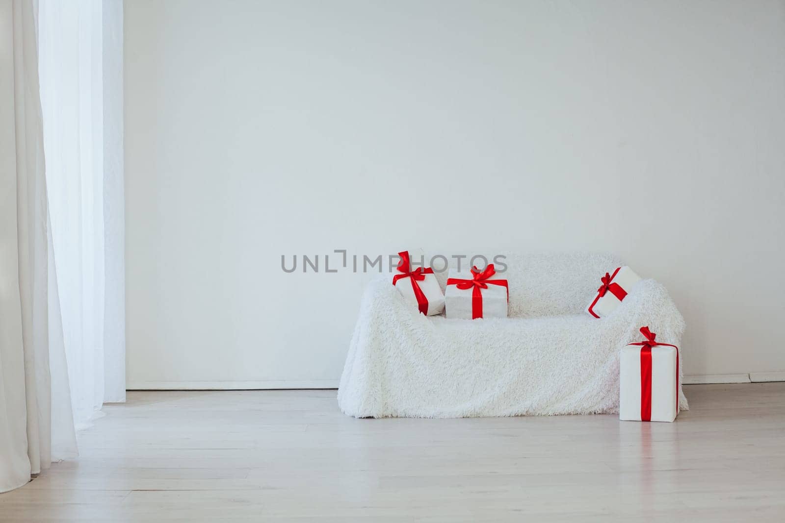 sofa with lots of gifts in the inder of the empty room
