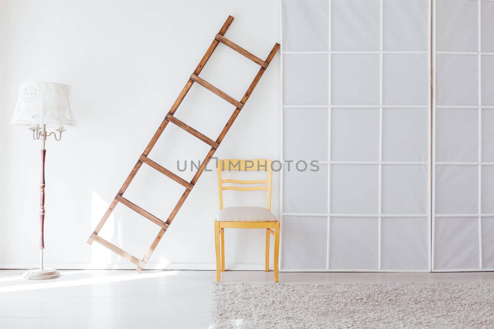 lamp staircase yellow chair in the interior of an empty white room by Simakov