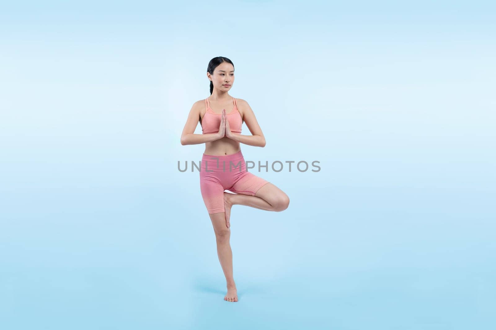 Asian woman in sportswear doing yoga exercise posing. Vigorous by biancoblue