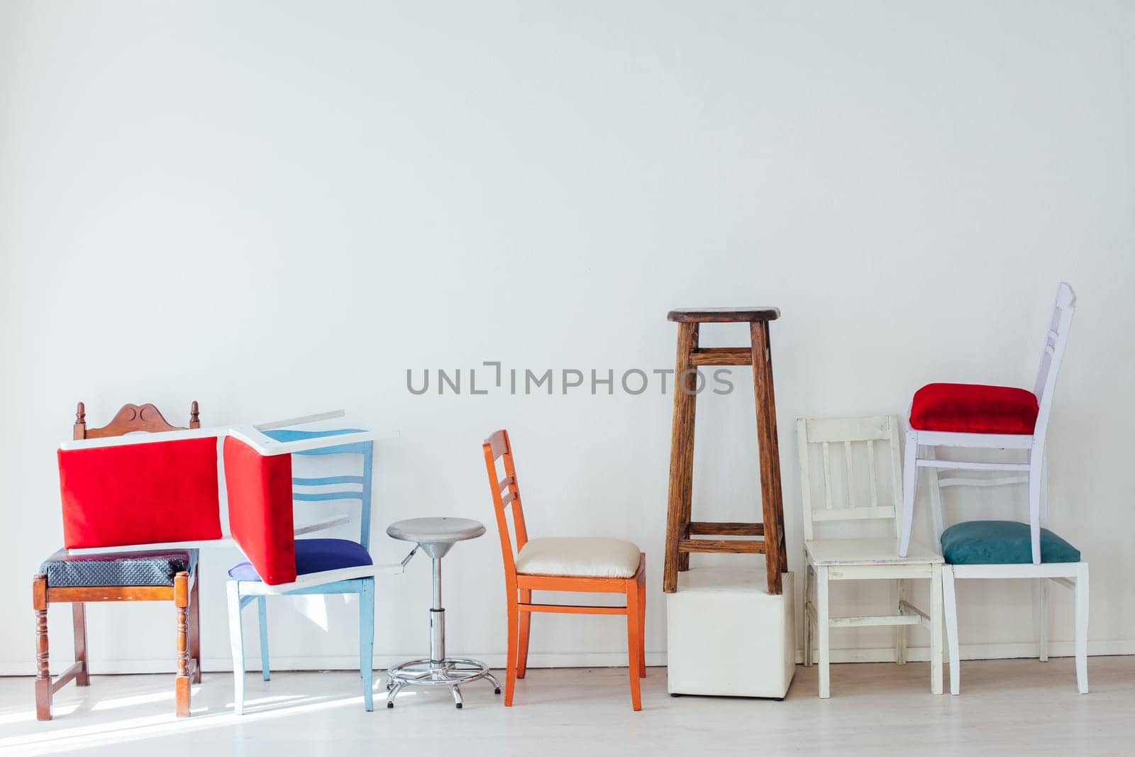 lots of different chairs in the interior of the white room by Simakov