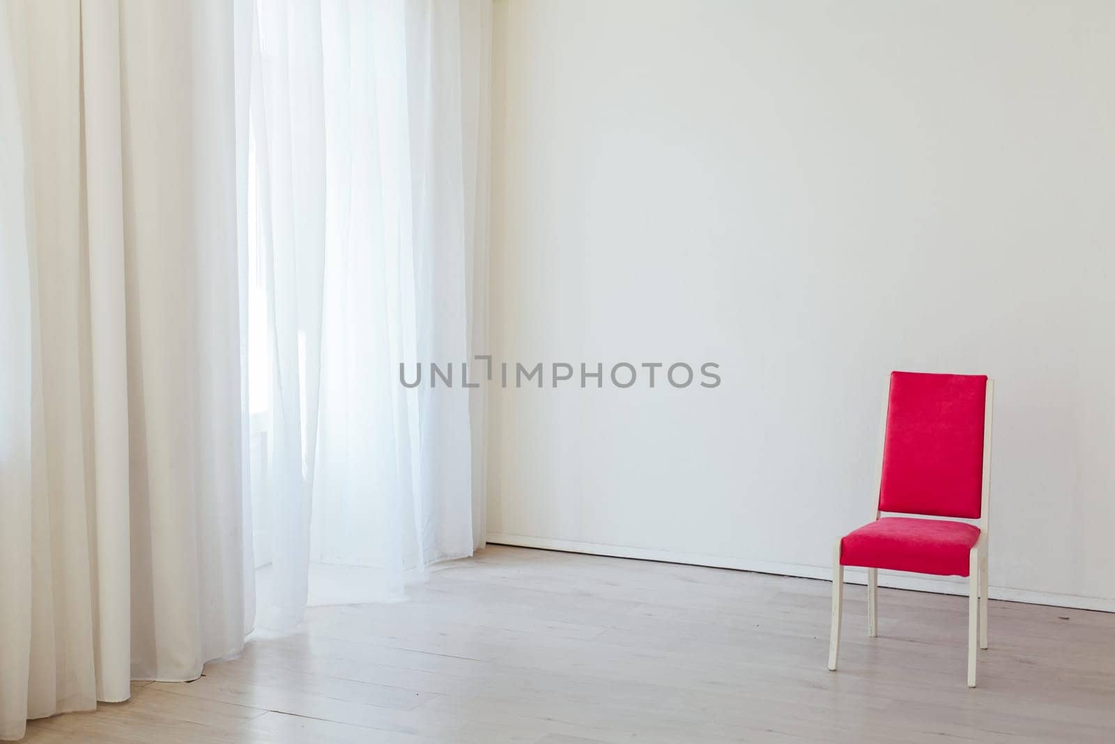 one red chair in the interior of an empty white office by Simakov