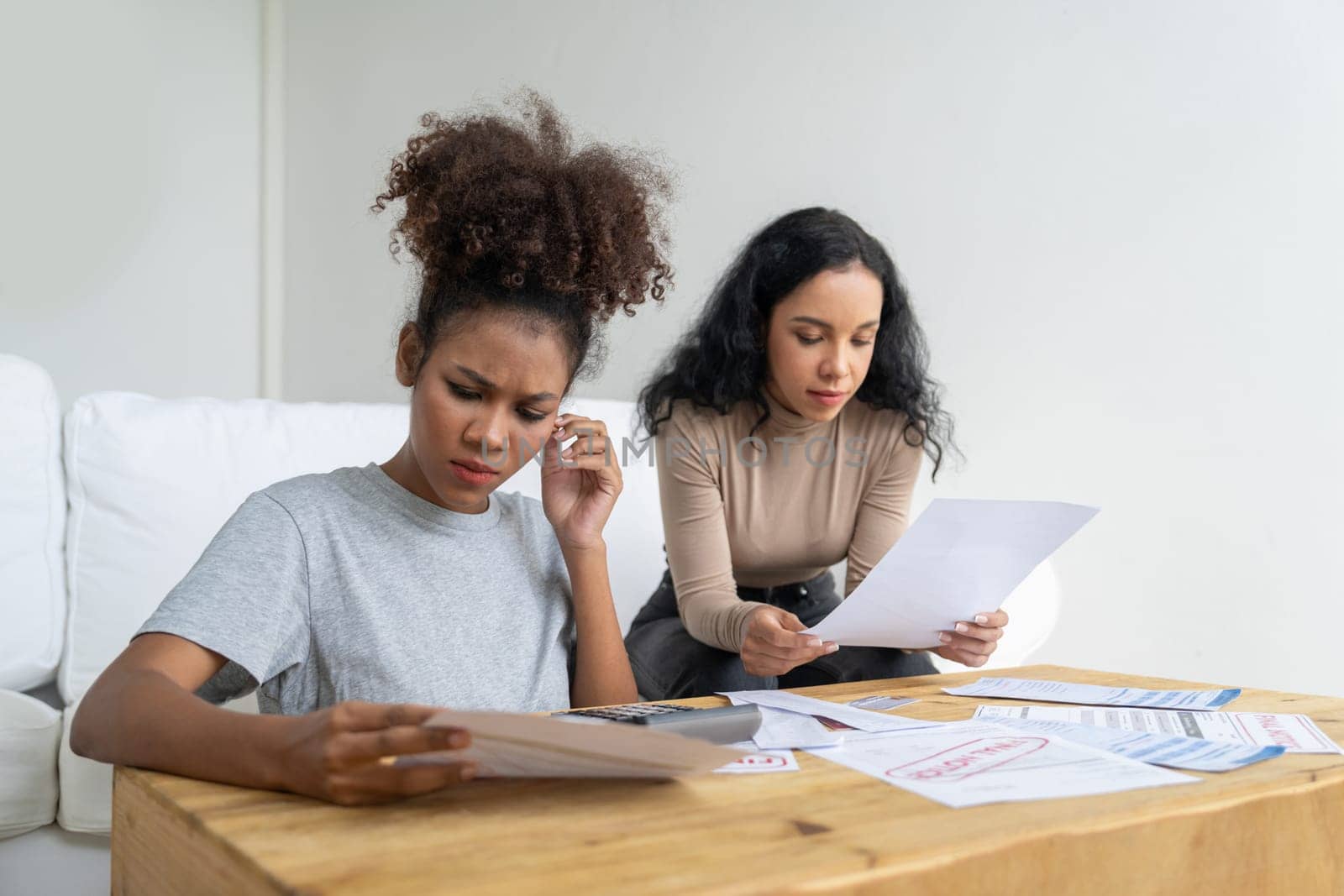 Stressed African American women has financial problems with credit card debt to pay crucial show concept of bad personal money and mortgage pay management crisis.