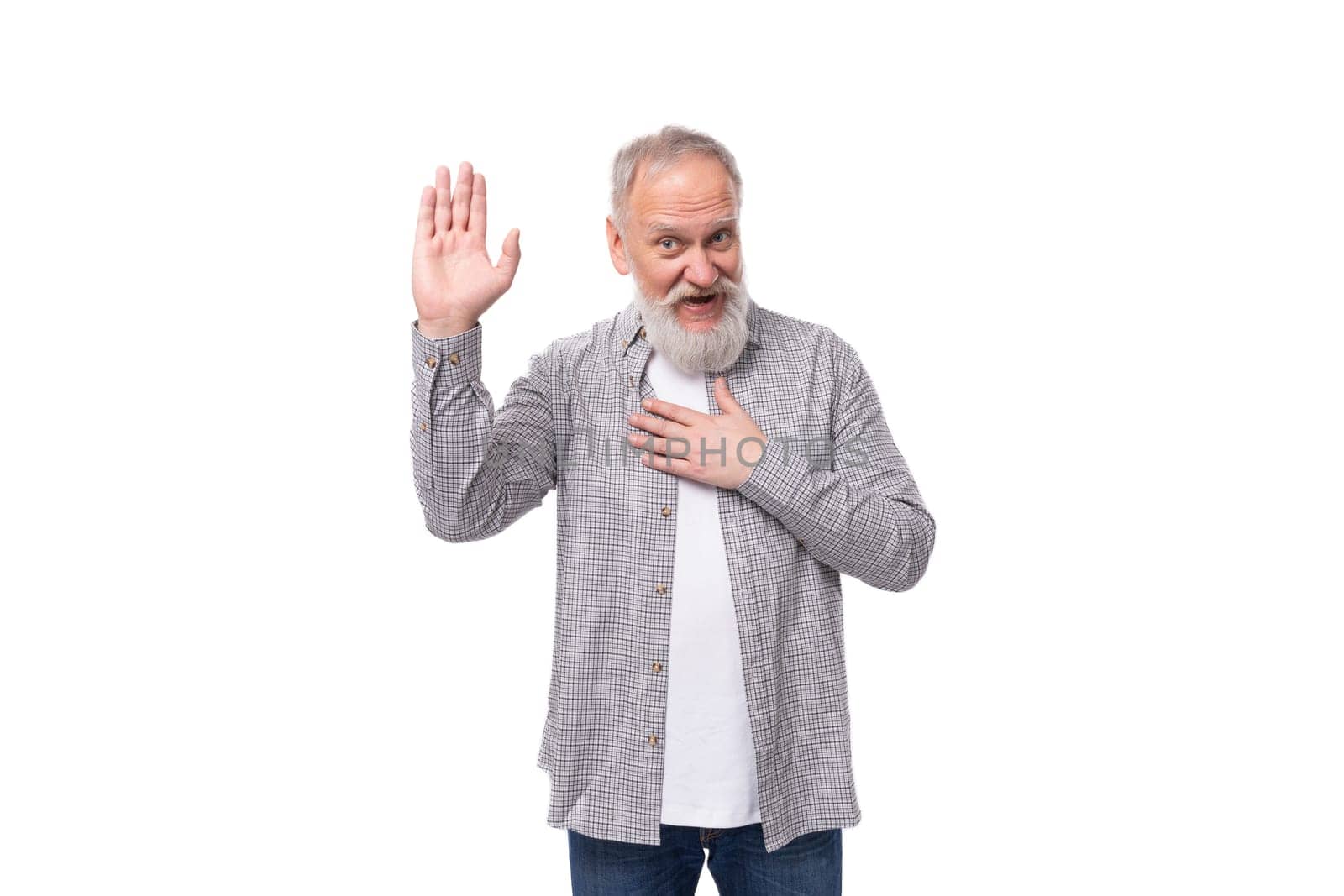 handsome funny gray-haired elderly man with a beard and mustache in a plaid shirt on a white background with copy space.