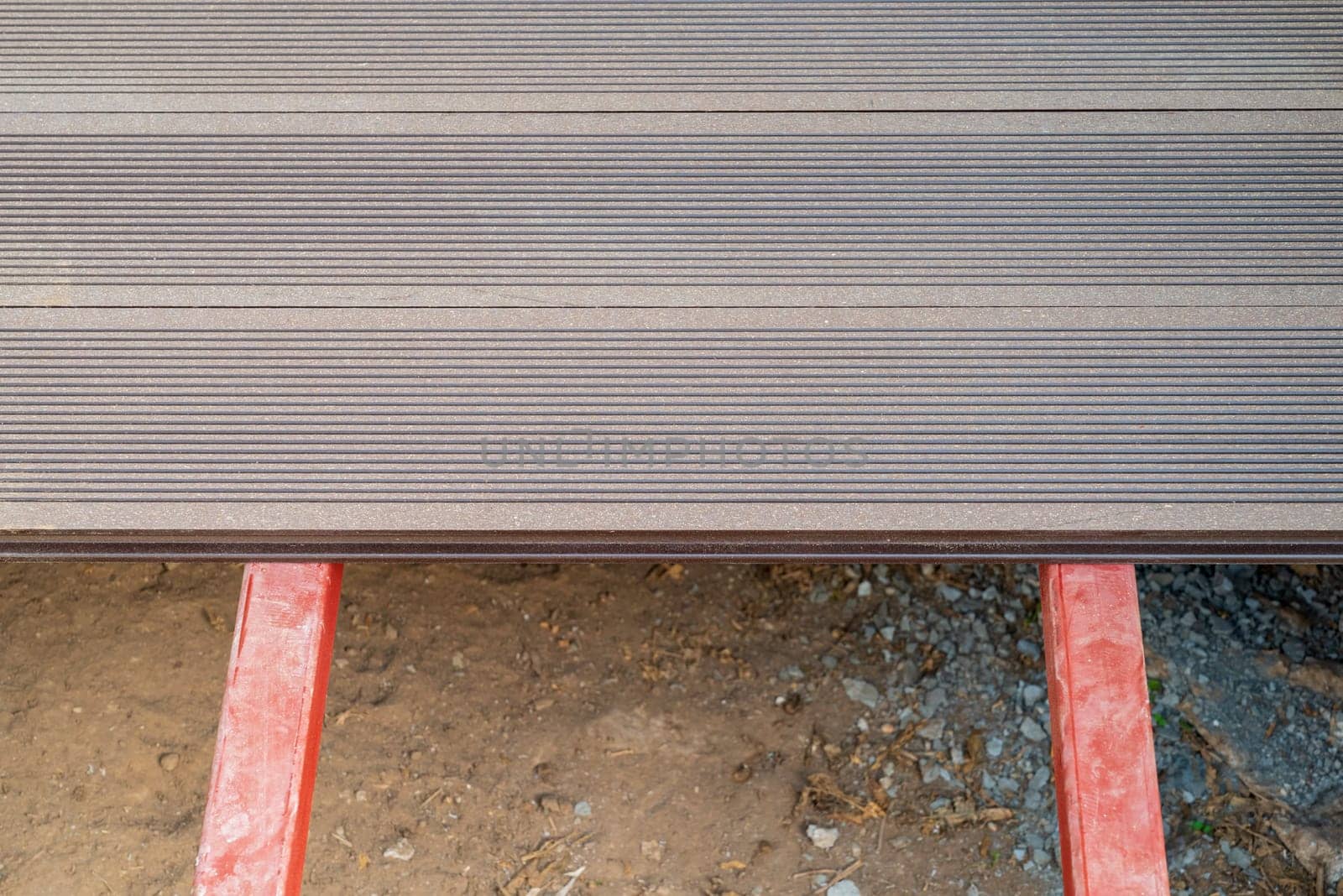 Brown WPC composite deck flooring mounted on steel profile