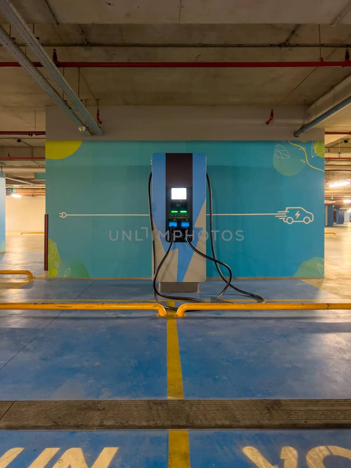 DC charging station to charge electric vehicles in the parking garage of the shopping mall by Sonat