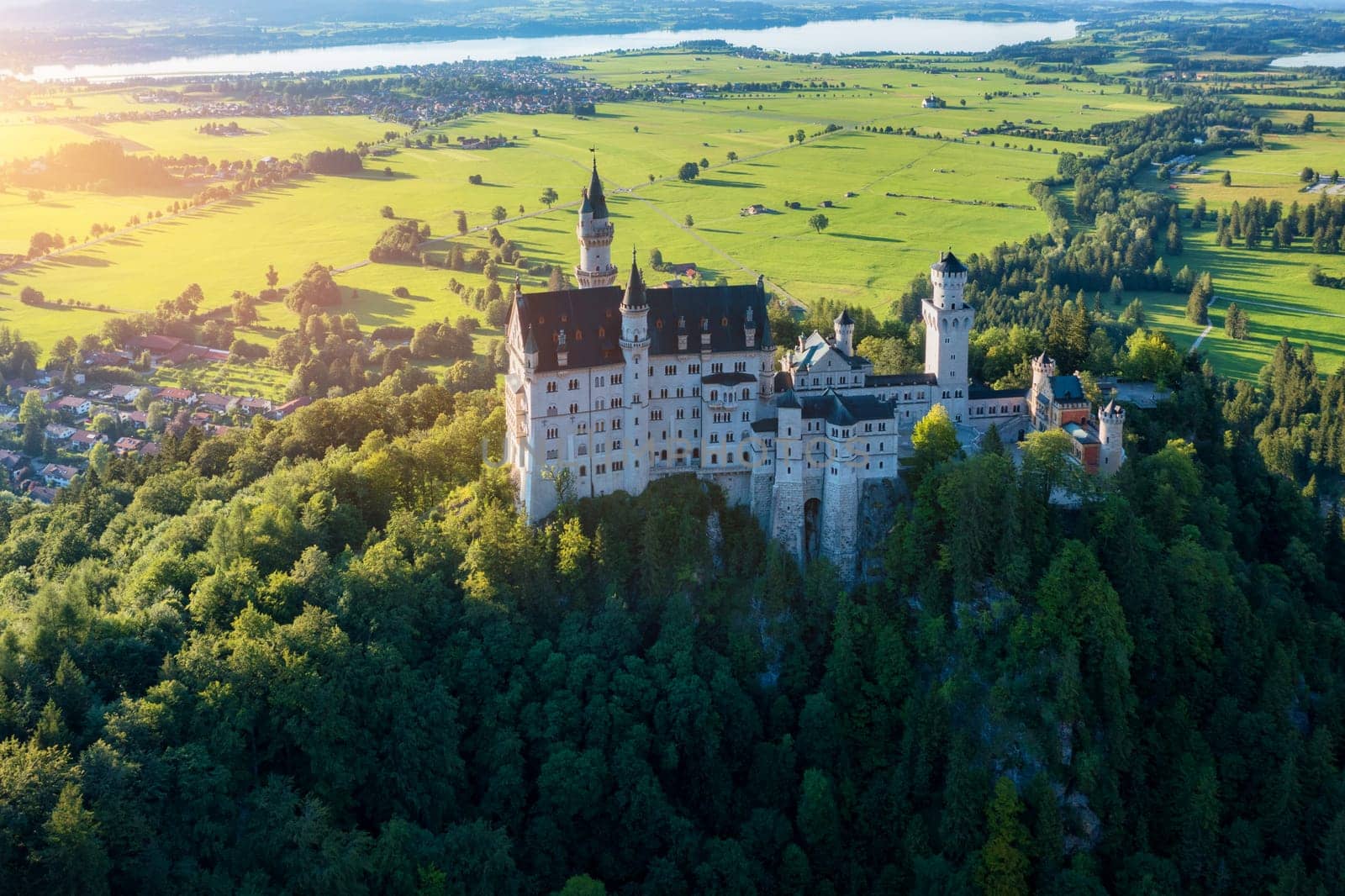 Famous Neuschwanstein Castle with scenic mountain landscape near Fussen, Bavaria, Germany. Neuschwanstein Castle in Hohenschwangau, Germany. 