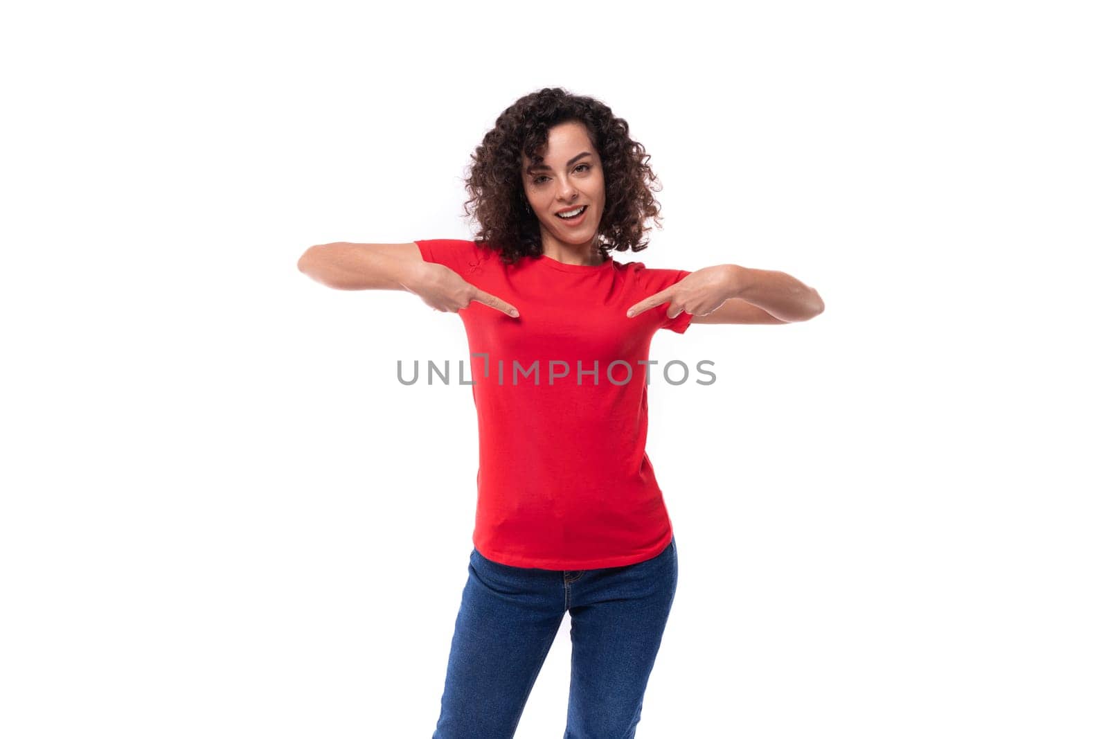 young pretty curly brunette woman dressed in red basic t-shirt with logo print mockup.