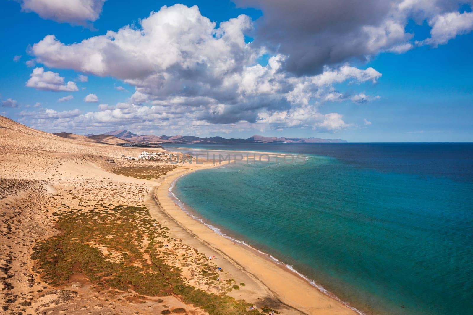 Jandia Peninsula, Risco del Paso, Playas de Sotavento and Laguna de Sotavento, Fuerteventura, Canary Islands, Spain, Atlantic, Europe. Kitesurfing flying in the ocean, Sotavento beach, Fuerteventura