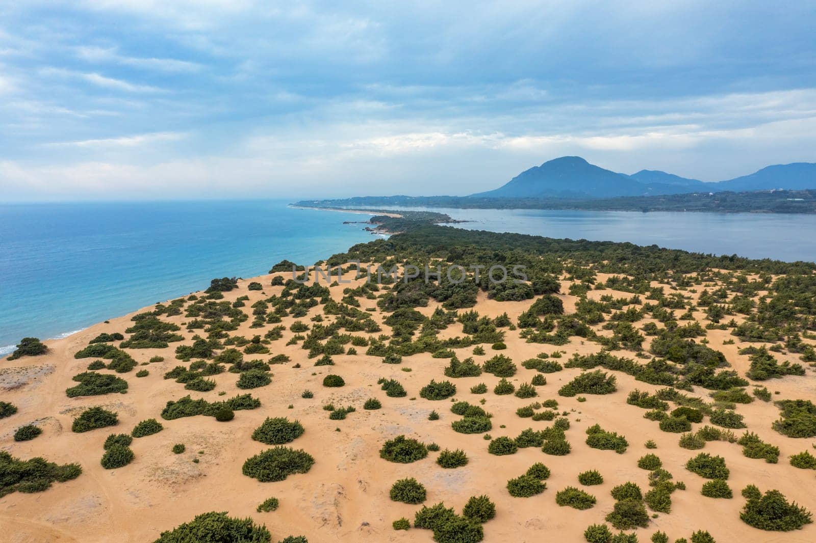 Issos beach on Corfu, near Agios Georgios, Greece. Aerial drone view of Issos beach and Lake Korission, Corfu island, Ionian Sea, Greece. Issos beach, Corfu Island.