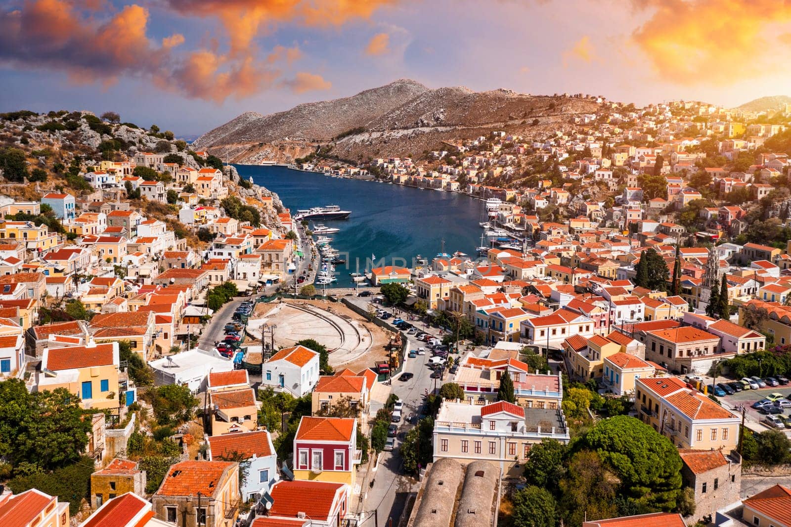 Aerial view of the beautiful greek island of Symi (Simi) with colourful houses and small boats. Greece, Symi island, view of the town of Symi (near Rhodes), Dodecanese.