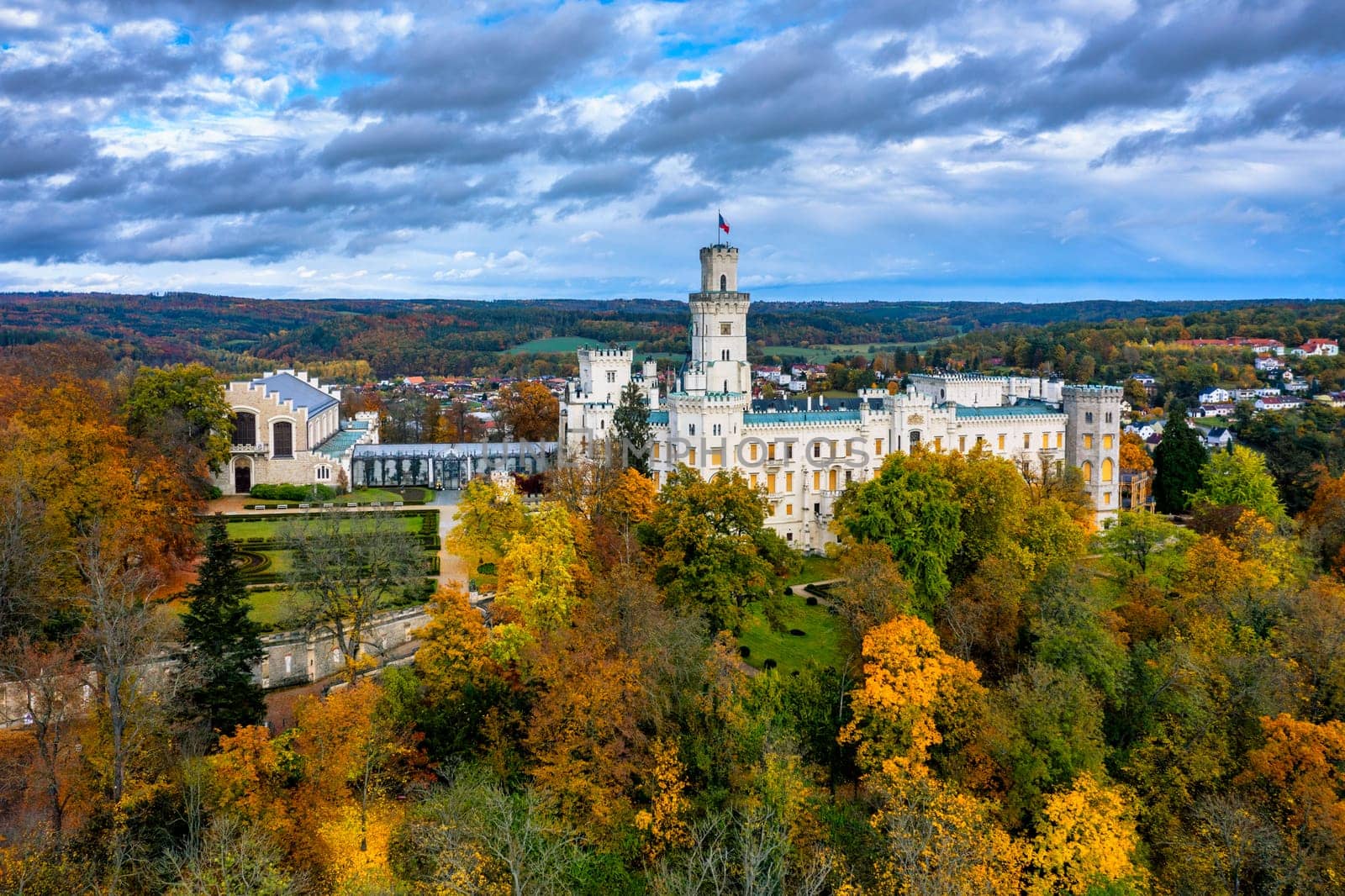 Castle Hluboka nad Vltavou is one of the most beautiful castles in Czech Republic. Castle Hluboka nad Vltavou in autumn with red foliage, Czechia. Colorful autumn view of Hluboka nad Vltavou castle.