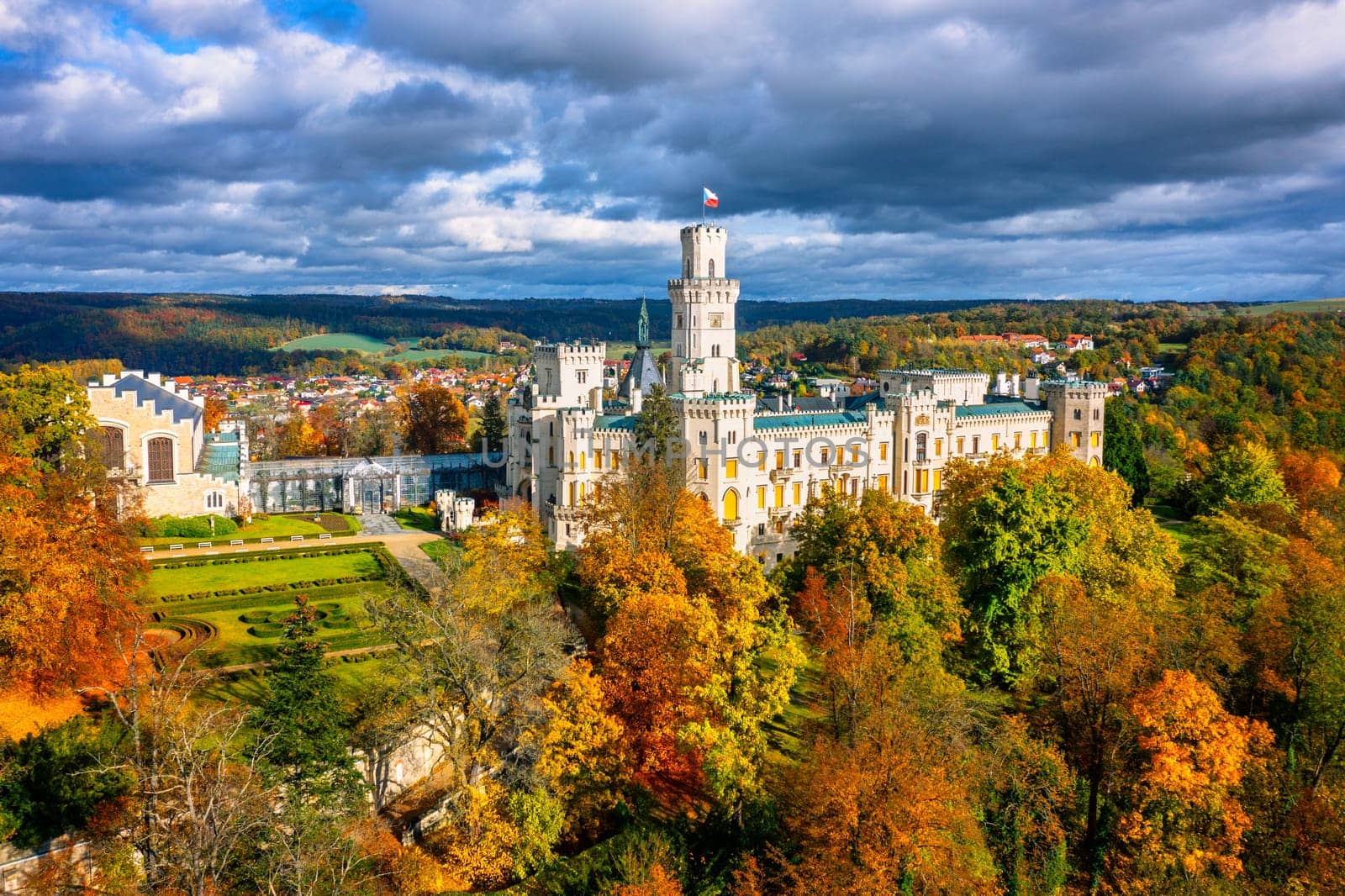 Castle Hluboka nad Vltavou is one of the most beautiful castles in Czech Republic. Castle Hluboka nad Vltavou in autumn with red foliage, Czechia. Colorful autumn view of Hluboka nad Vltavou castle.