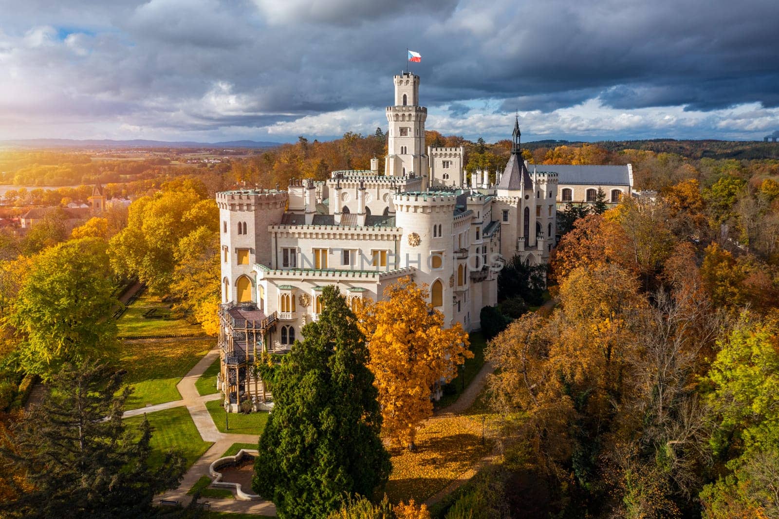 Castle Hluboka nad Vltavou is one of the most beautiful castles in Czech Republic. Castle Hluboka nad Vltavou in autumn with red foliage, Czechia. Colorful autumn view of Hluboka nad Vltavou castle.