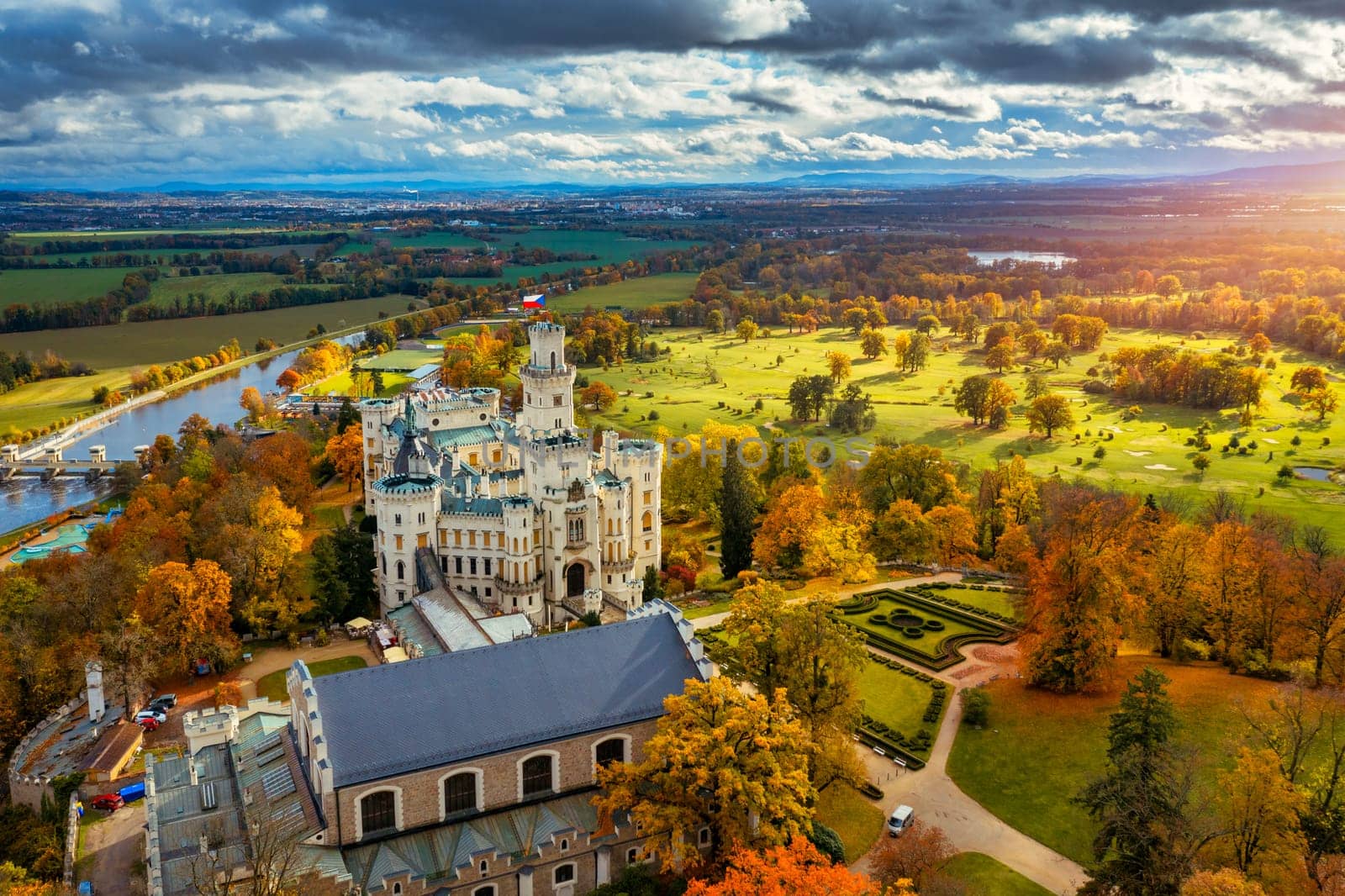 Castle Hluboka nad Vltavou is one of the most beautiful castles in Czech Republic. Castle Hluboka nad Vltavou in autumn with red foliage, Czechia. Colorful autumn view of Hluboka nad Vltavou castle.