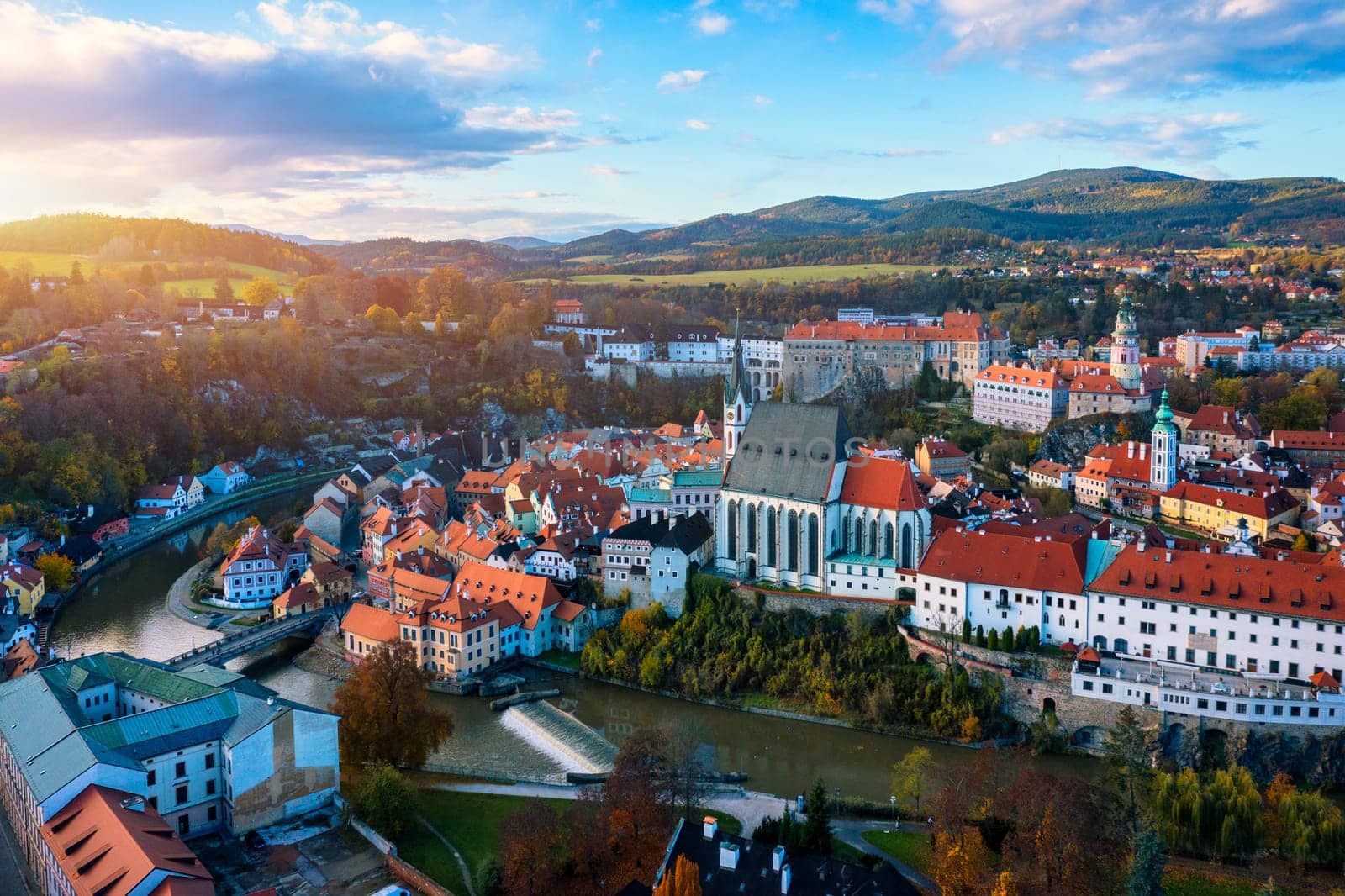 Aerial view of historical centre of Cesky Krumlov town on Vltava riverbank on autumn day overlooking medieval Castle, Czech Republic. View of old town of Cesky Krumlov, South Bohemia, Czech Republic.