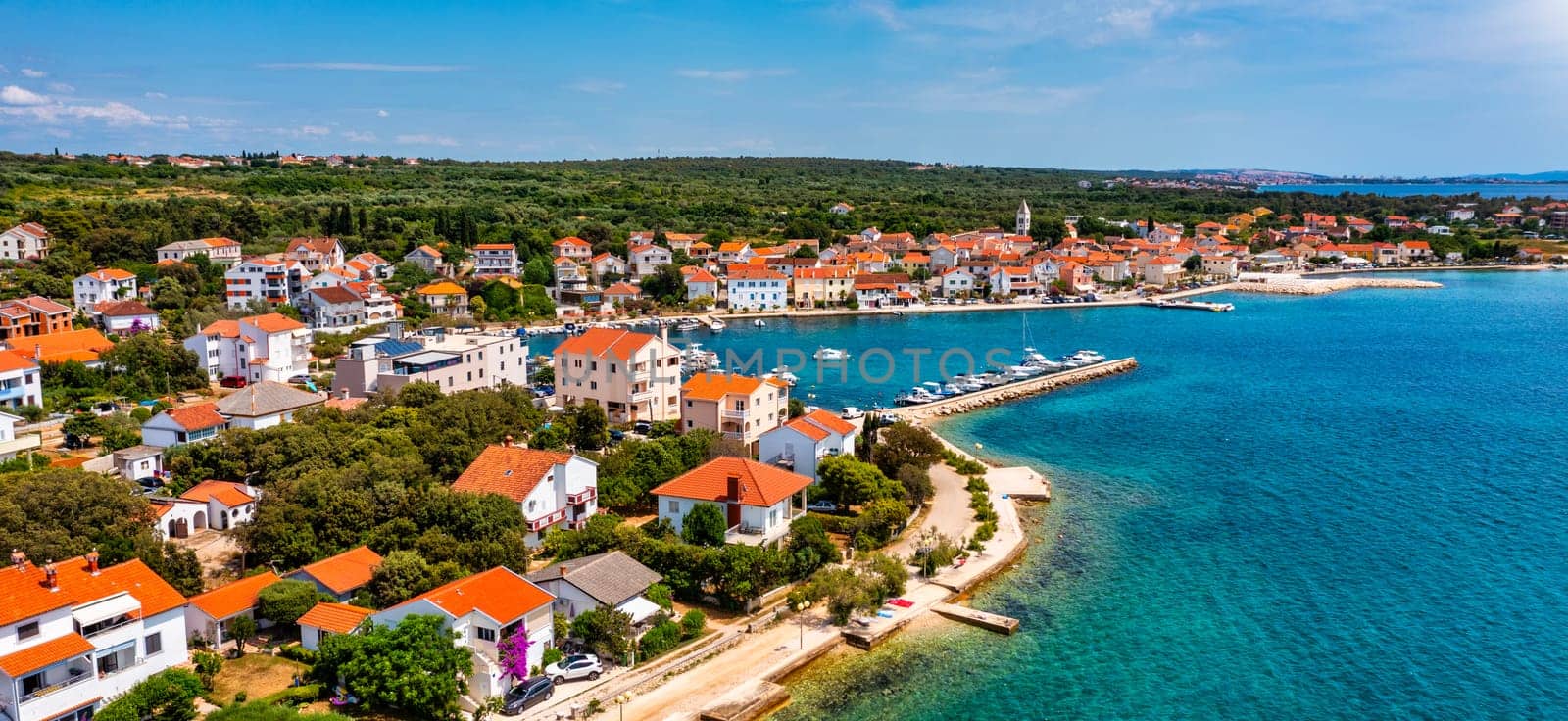 Petrcane village tourist destination coastline aerial panoramic view, Dalmatia region of Croatia. Aerial top view of village Petrcane, Croatia. Petrcane aerial view, Dalmatia region of Croatia