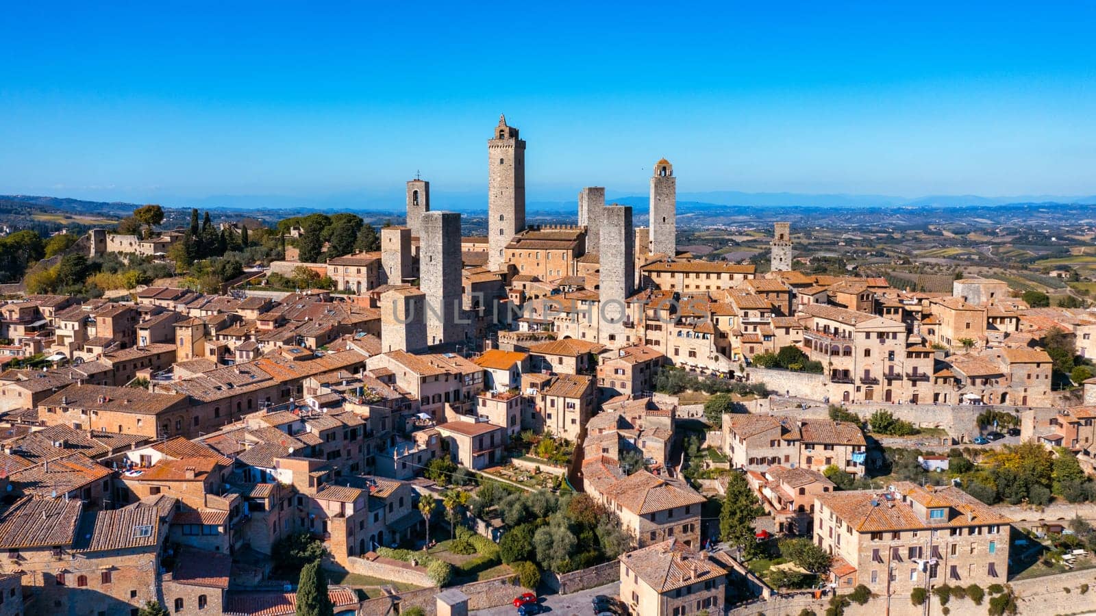 Town of San Gimignano, Tuscany, Italy with its famous medieval towers. Aerial view of the medieval village of San Gimignano, a Unesco World Heritage Site. Italy, Tuscany, Val d'Elsa.