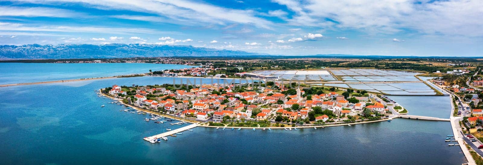 Historic town of Nin laguna aerial view with Velebit mountain background, Dalmatia region of Croatia. Aerial view of the famous Nin lagoon and medieval in Croatia