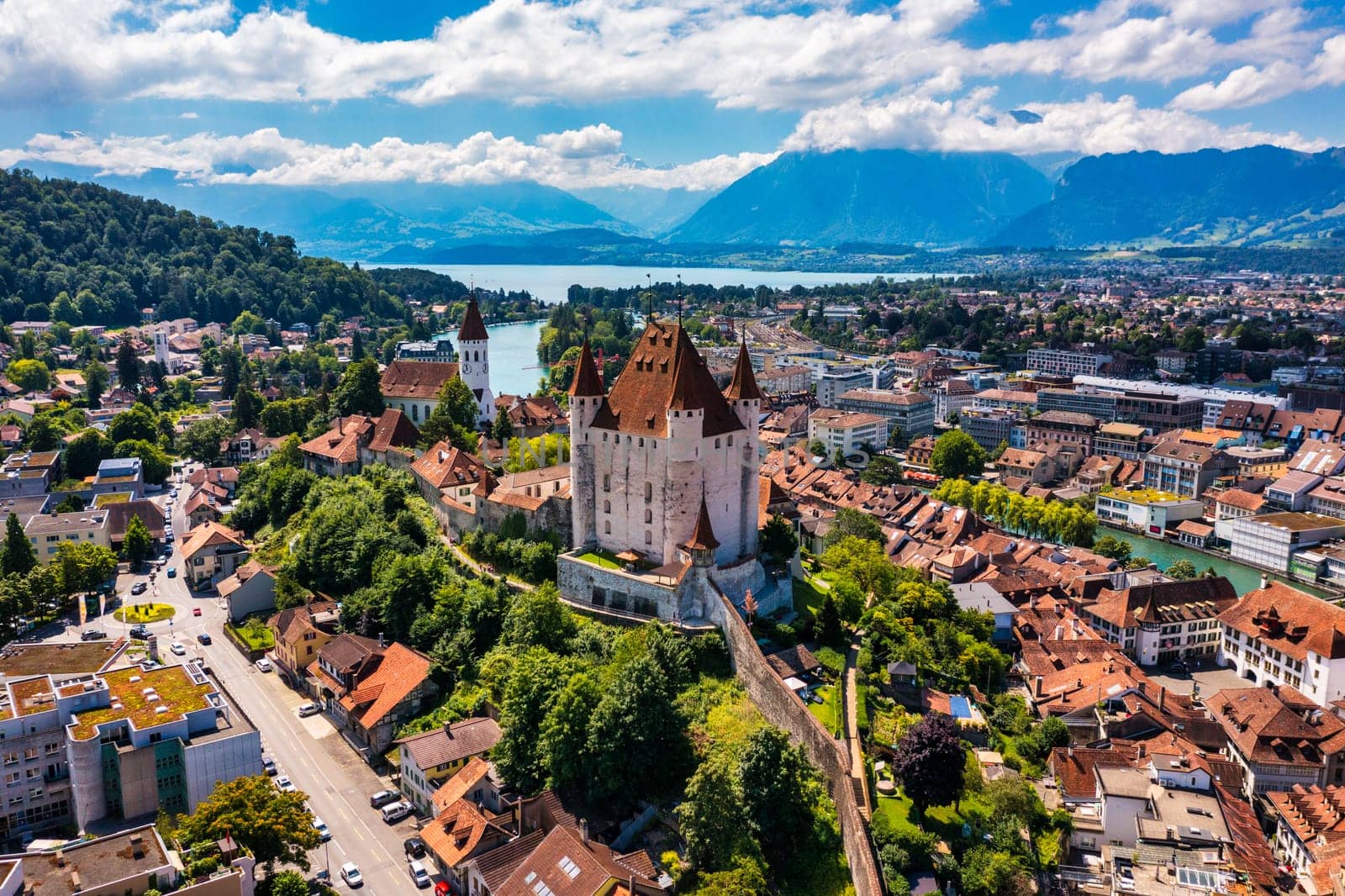 Panorama of Thun city with Alps and Thunersee lake, Switzerland. Historical Thun city and lake Thun with Bernese Highlands swiss Alps mountains in background, Canton Bern, Switzerland.