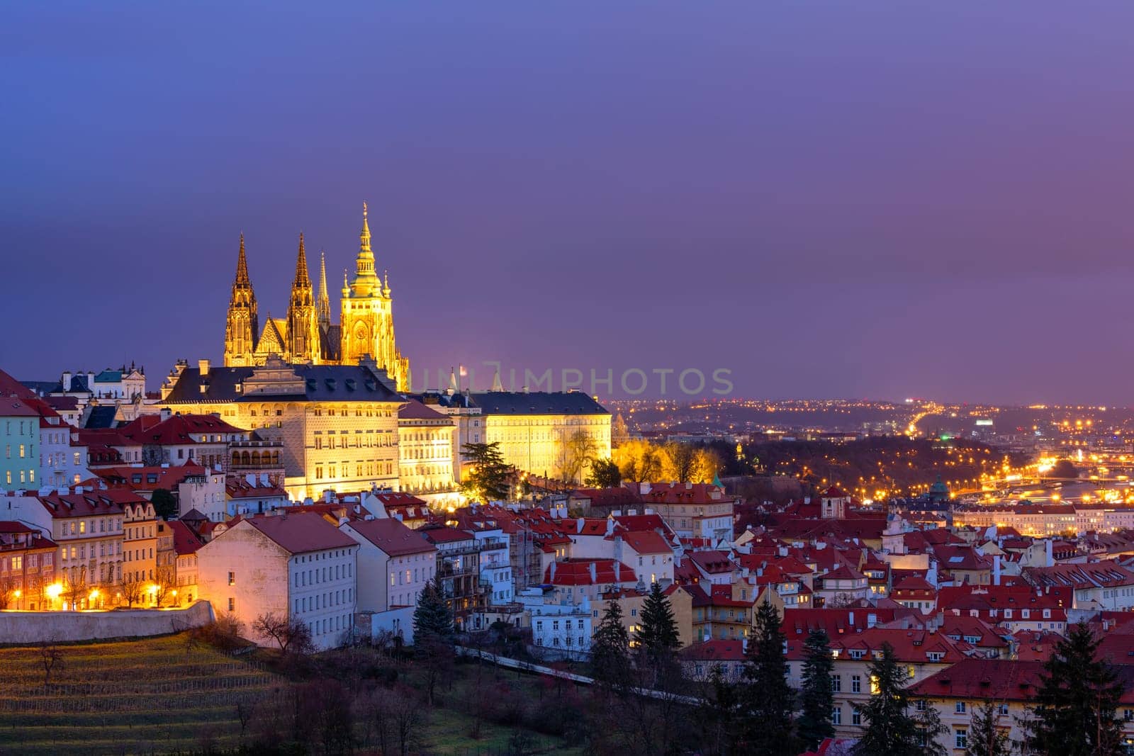 Prague Castle and Lesser Town panorama by night. View from Petrin Hill. Prague, Czech Republic. View of Prague Castle from Strahov monastery at night. Prague, Czech Republic 