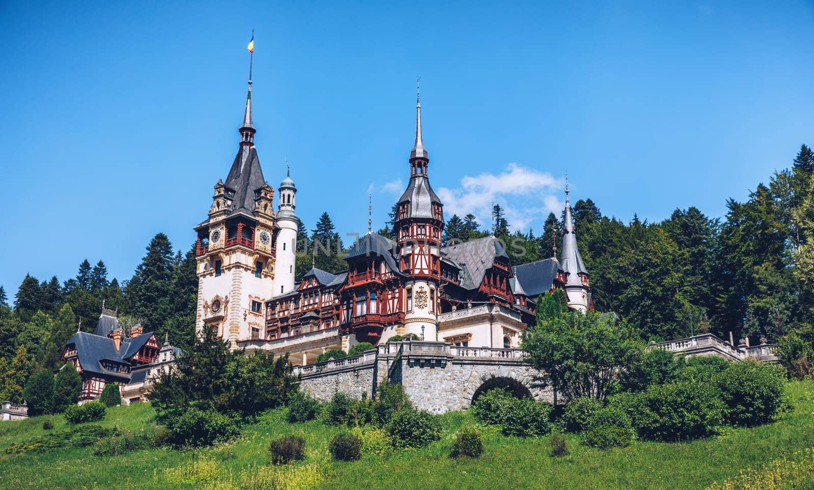 Peles Castle, Romania. Beautiful famous royal castle and ornamental garden in Sinaia landmark of Carpathian Mountains in Europe
