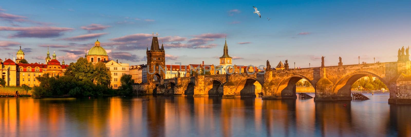 Charles Bridge in Prague in Czechia. Prague, Czech Republic. Charles Bridge (Karluv Most) and Old Town Tower. Vltava River and Charles Bridge. Concept of world travel, sightseeing and tourism.