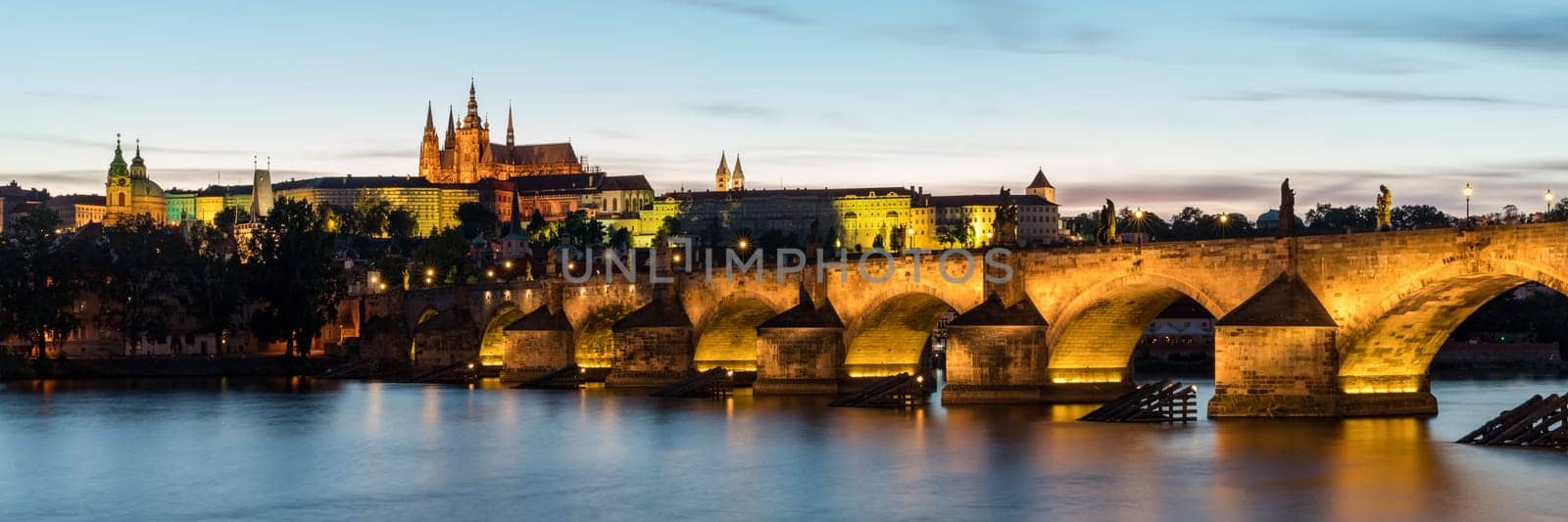 Charles Bridge in Prague in Czechia. Prague, Czech Republic. Charles Bridge (Karluv Most) and Old Town Tower. Vltava River and Charles Bridge. Concept of world travel, sightseeing and tourism.