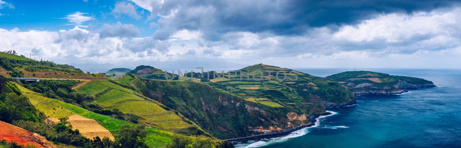 View from Miradouro de Santa Iria on the island of São Miguel in the Azores. The view shows part of the northern coastline with cliffs and green fields on the clifftop. Azores, Sao Miguel, Portugal