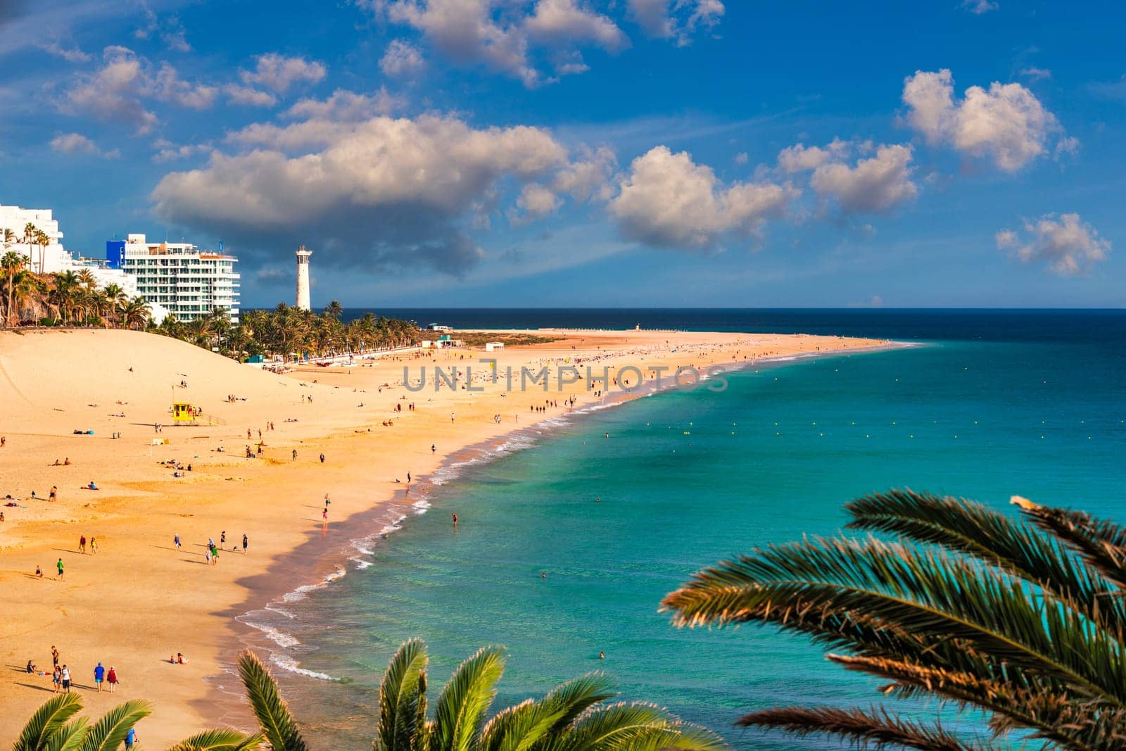 Morro Jable, Fuerteventura, Spain. Breathtaking beach Playa del Matorral in the rays of the sunset. Morro Jable and Playa del Matorral, Fuerteventura, Canary Islands, Spain, Atlantic, Europe by DaLiu