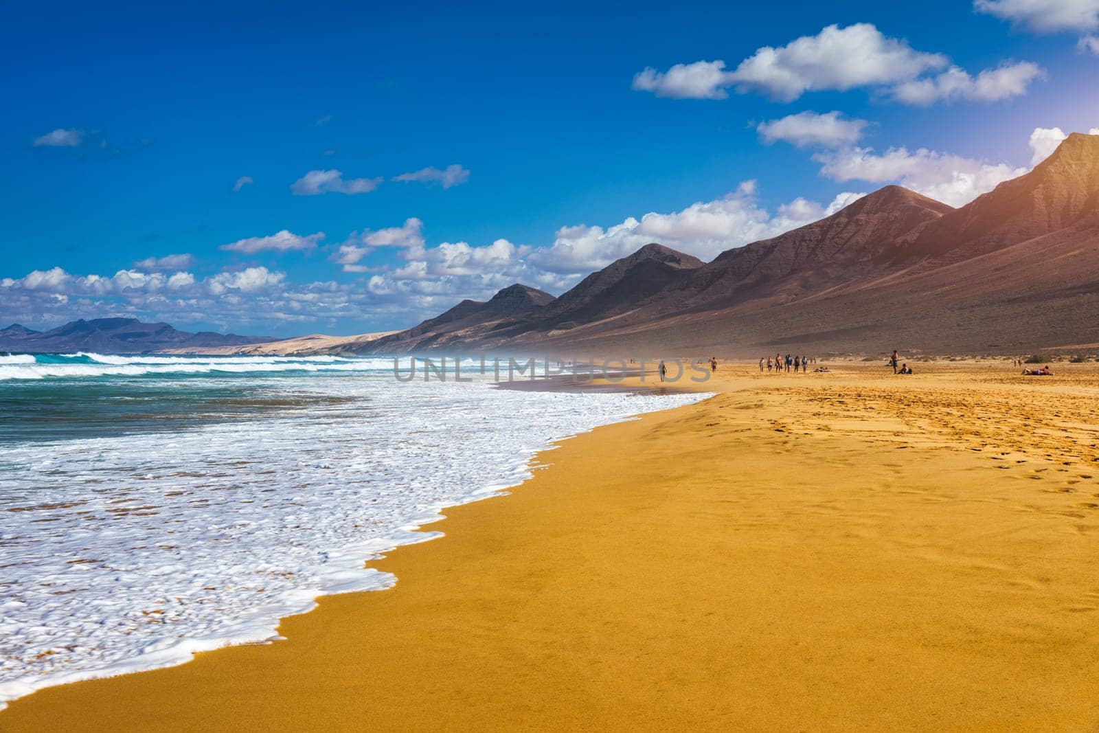 Amazing Cofete beach with endless horizon. Volcanic hills in the background and Atlantic Ocean. Cofete beach, Fuerteventura, Canary Islands, Spain. Playa de Cofete, Fuerteventura, Canary Islands. by DaLiu