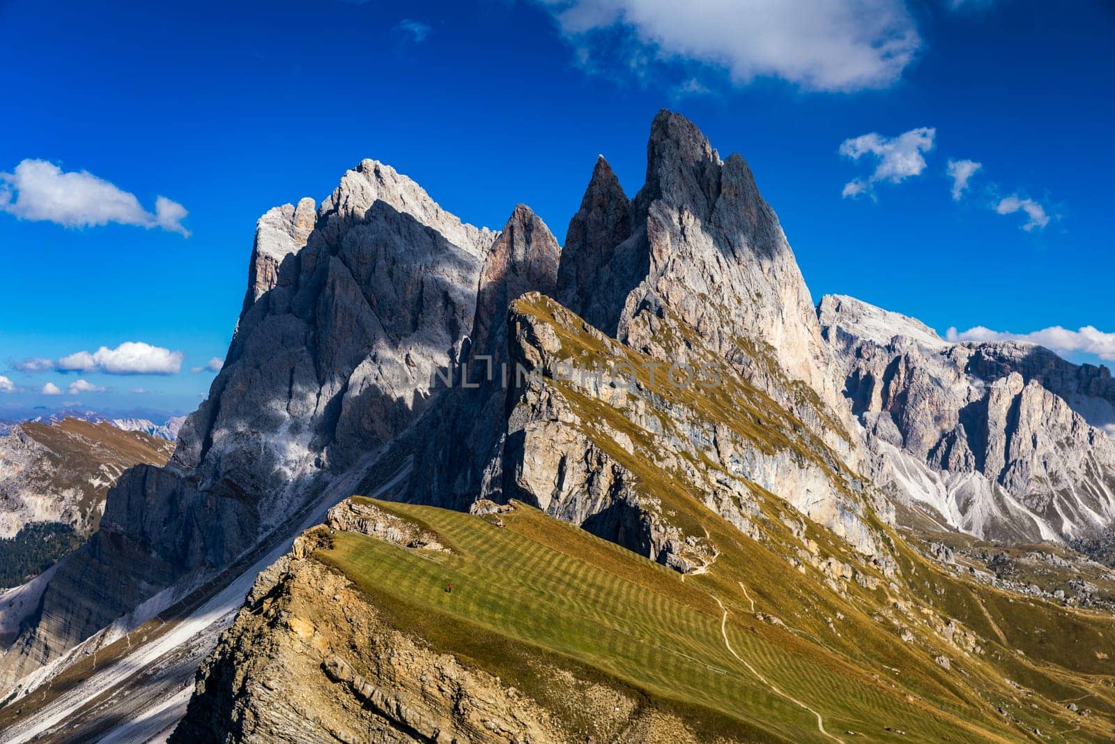 View on Seceda peak. Trentino Alto Adige, Dolomites Alps, South Tyrol, Italy. Odle mountain range, Val Gardena. Majestic Furchetta peak. Odles group seen from Seceda, Santa Cristina Val Gardena.