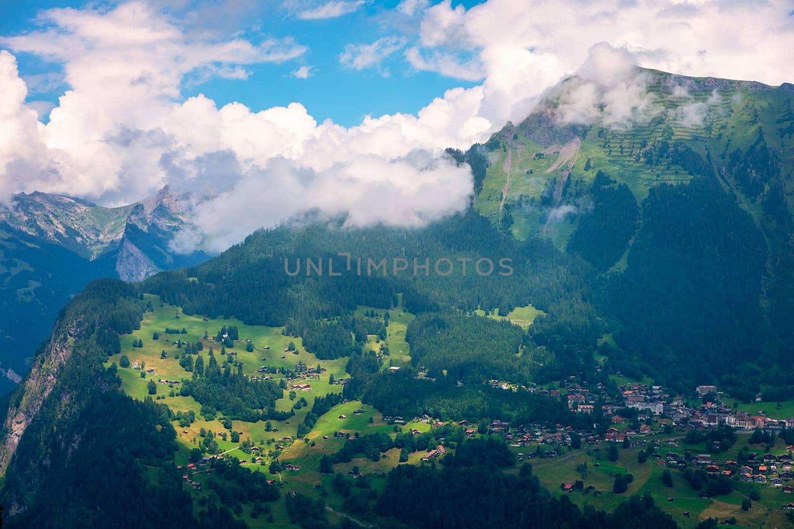 Townscape of village of Wengen on the edge of Lauterbrunnen Valley. Traditional local houses in Wengen village in the Interlaken district in the Bern canton of Switzerland. by DaLiu
