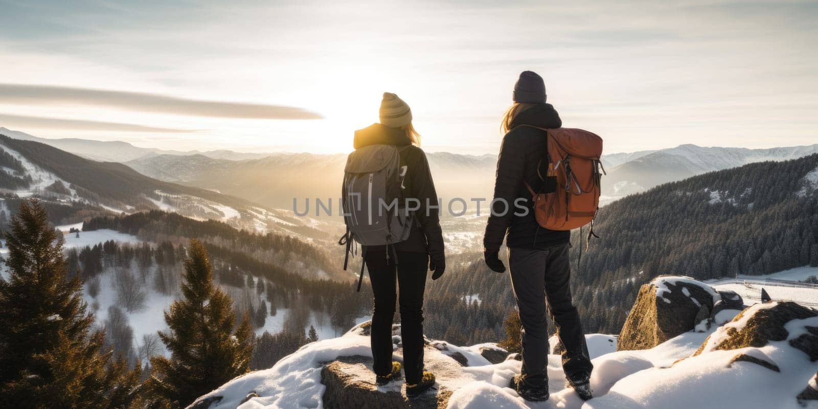 Eco travel and responsible tourism. Couple hiking in mountains in winter, rear view. AI Generated