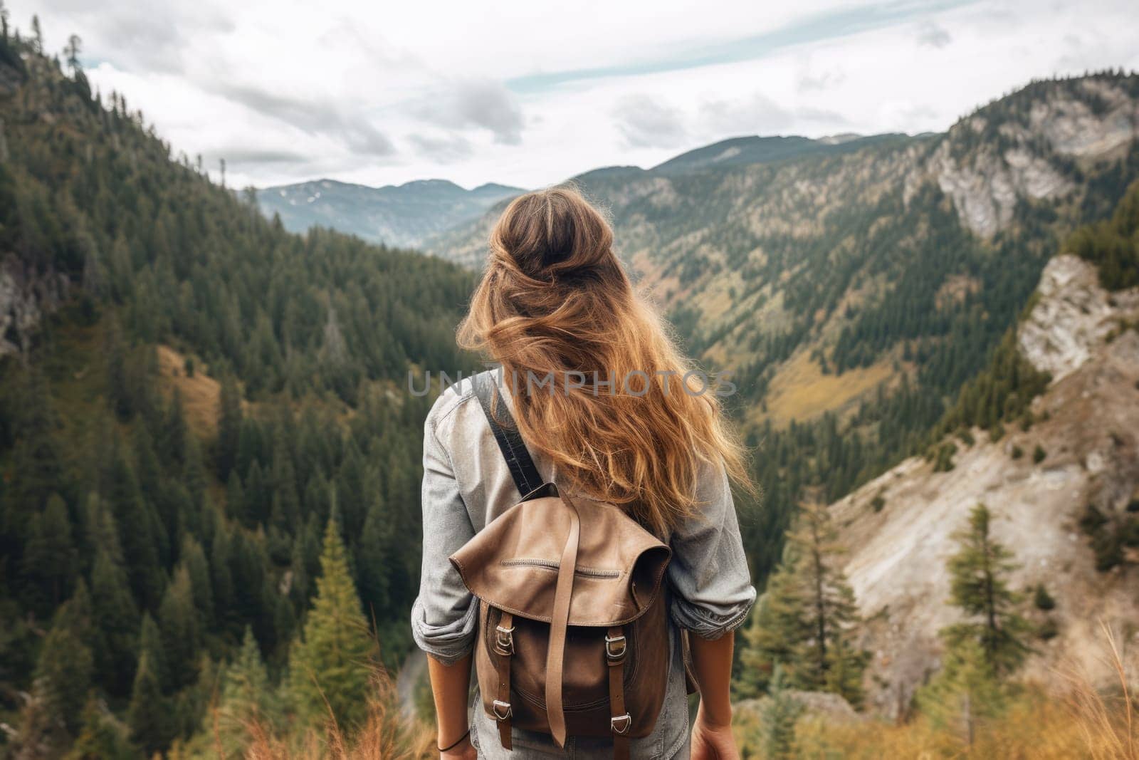 gen z woman travels through the mountains of wild nature. AI Generated by Desperada