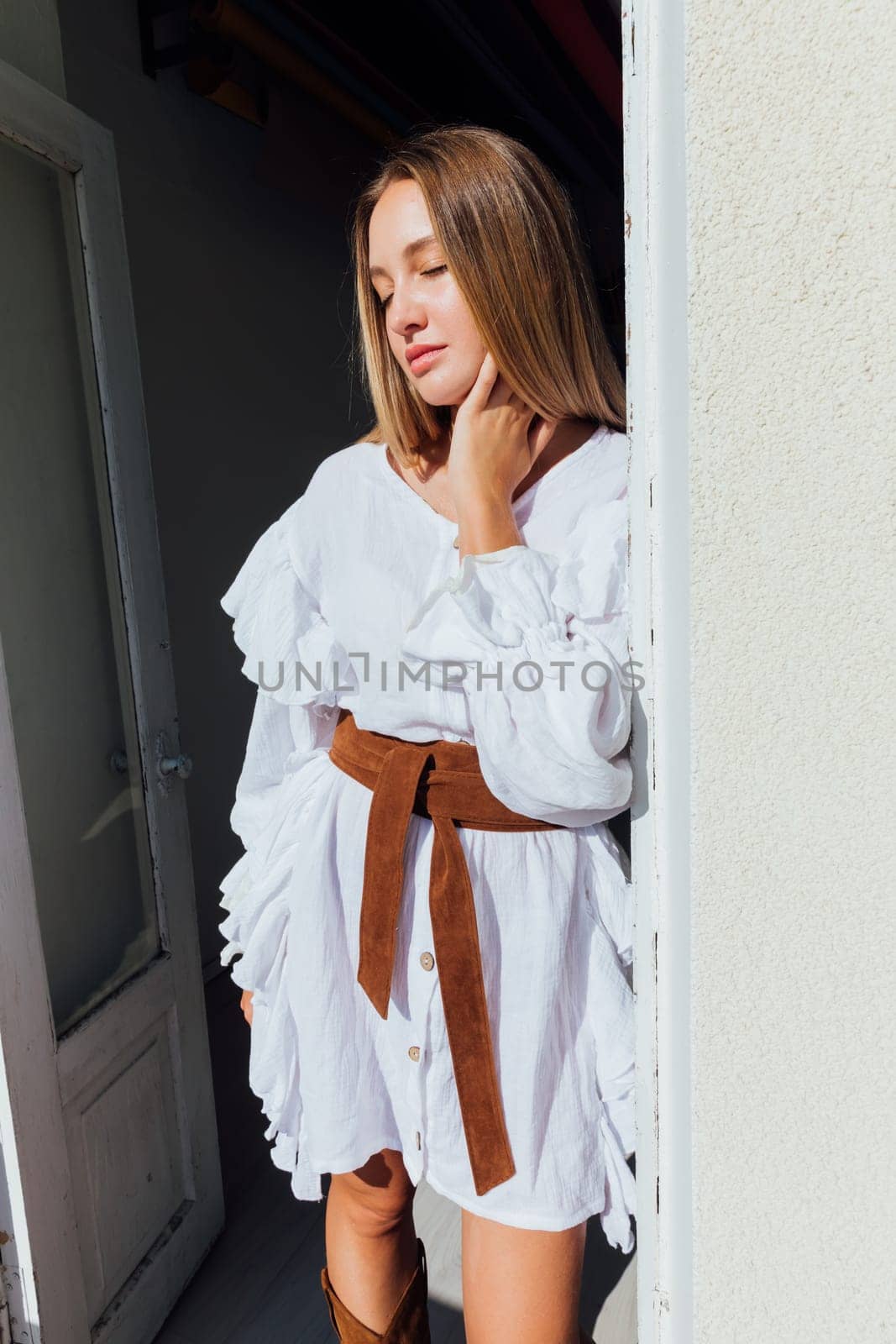 fashionable woman in white vintage western dress