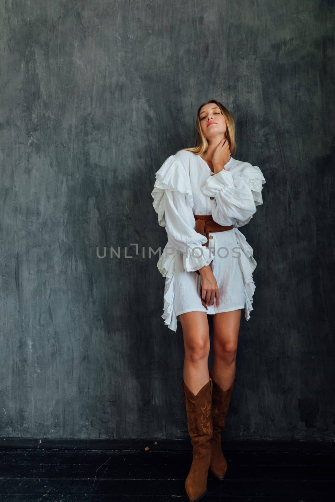fashionable woman in white vintage western dress