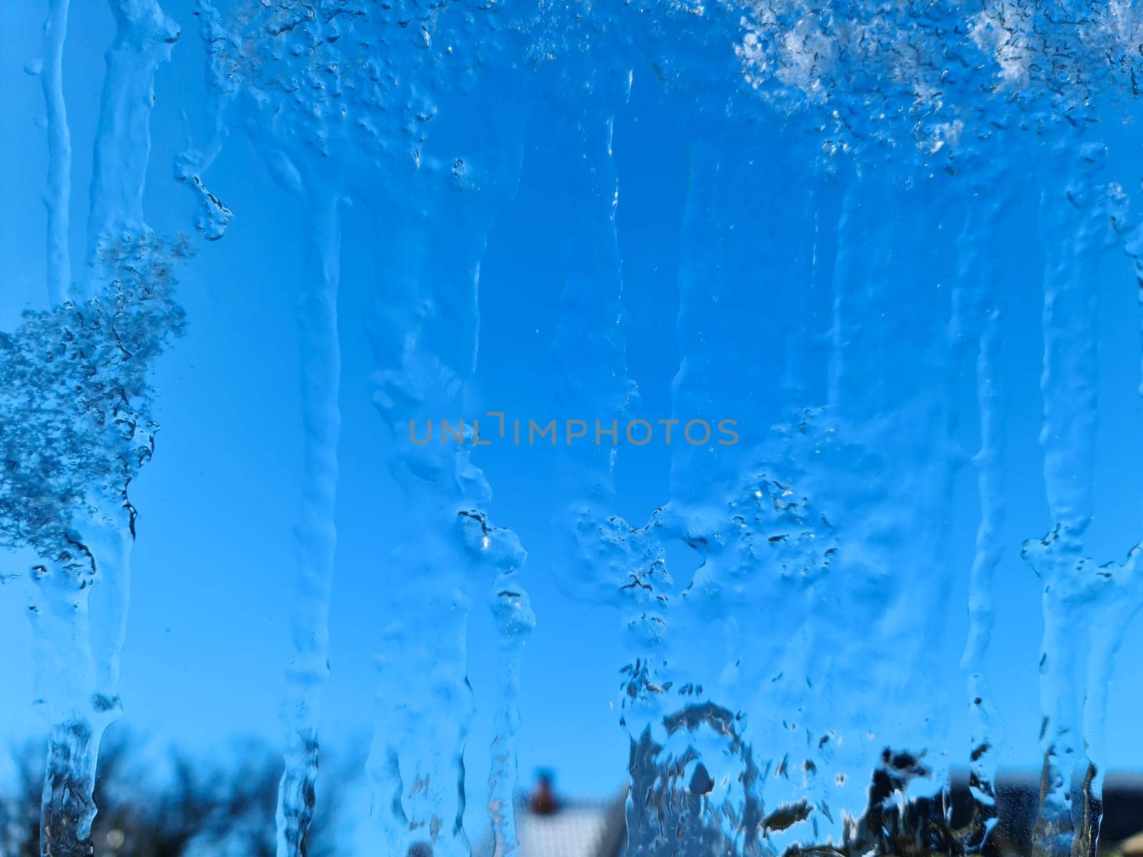 Frozen ice on a window with a blue sky background. by MP_foto71