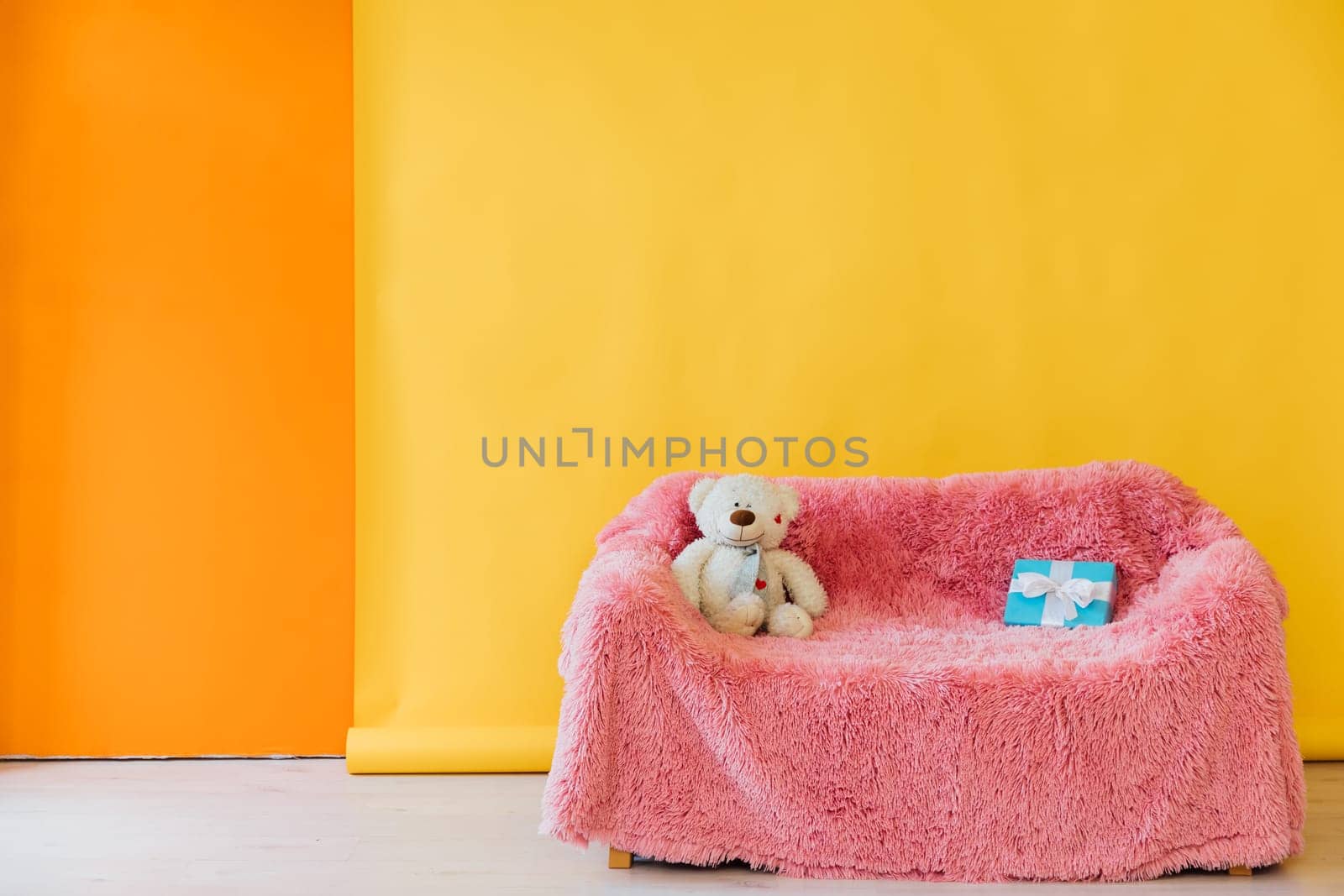 Yellow orange room interior with grey black office sofa at home by Simakov