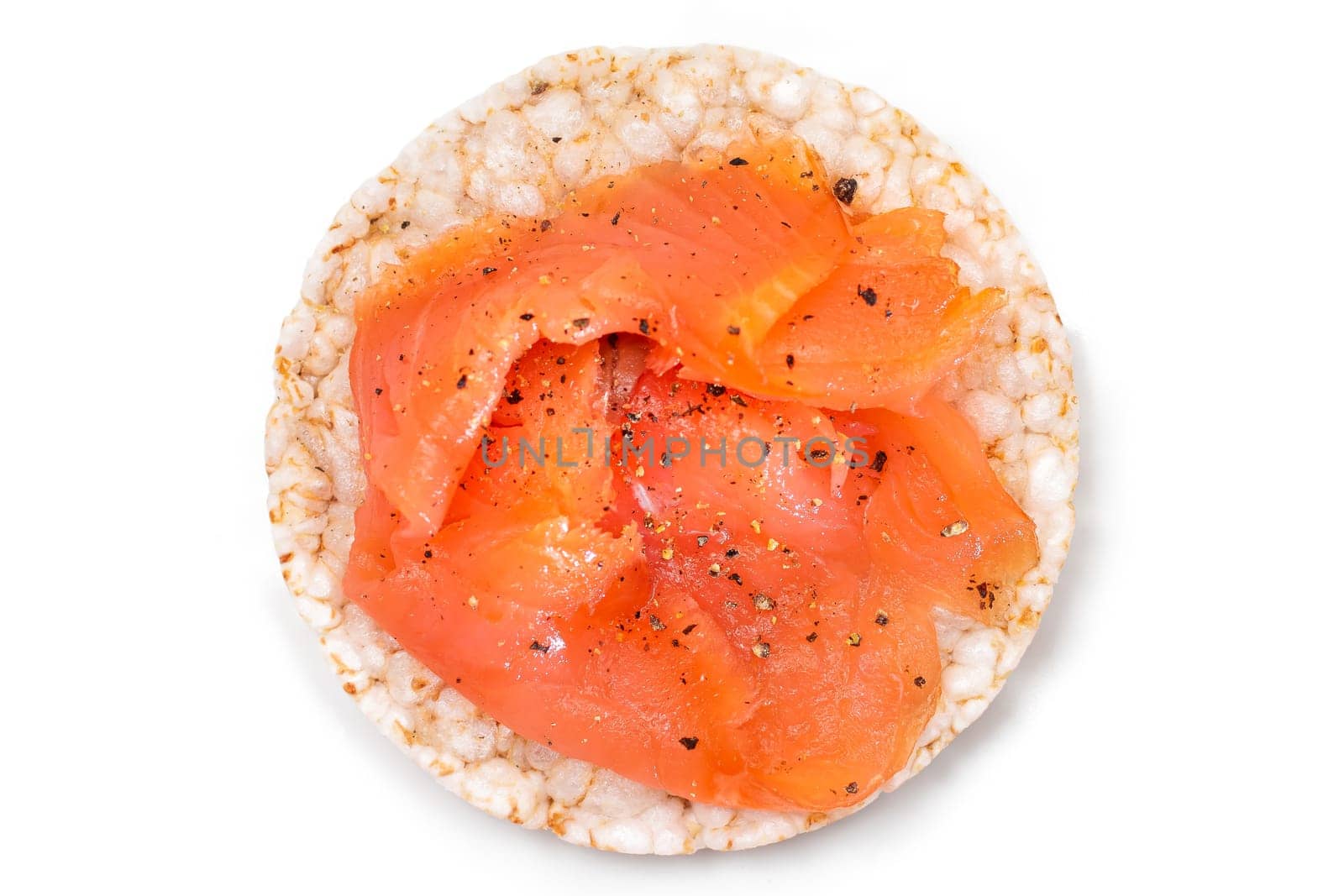 Tasty Rice Cake Sandwich with Fresh Salmon Slices Isolated on White - Top View. Easy Breakfast and Diet Food. Crispbread with Red Fish. Healthy Dietary Snack - Isolation