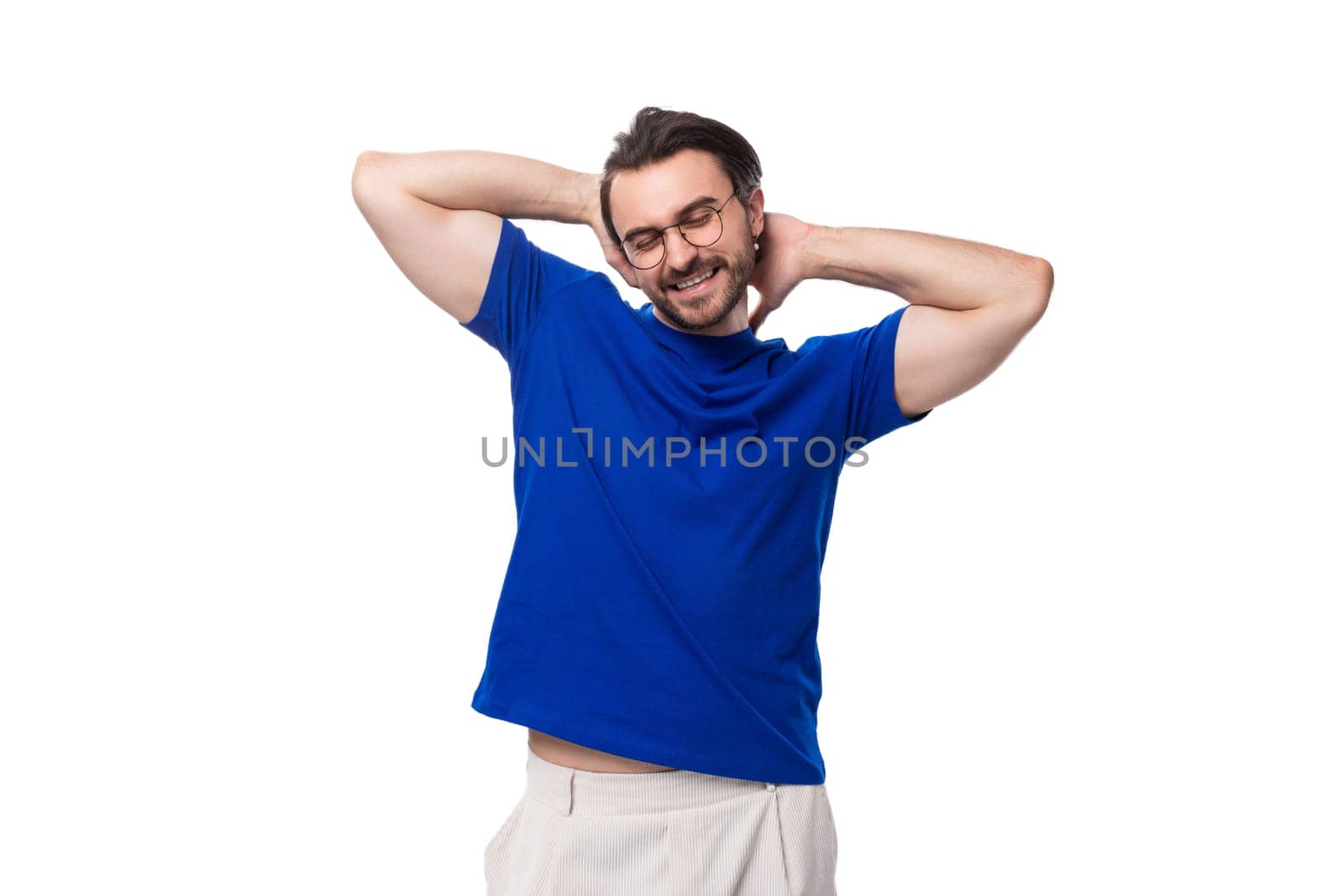 young handsome brunette man with beard in blue t-shirt with identity mockup.