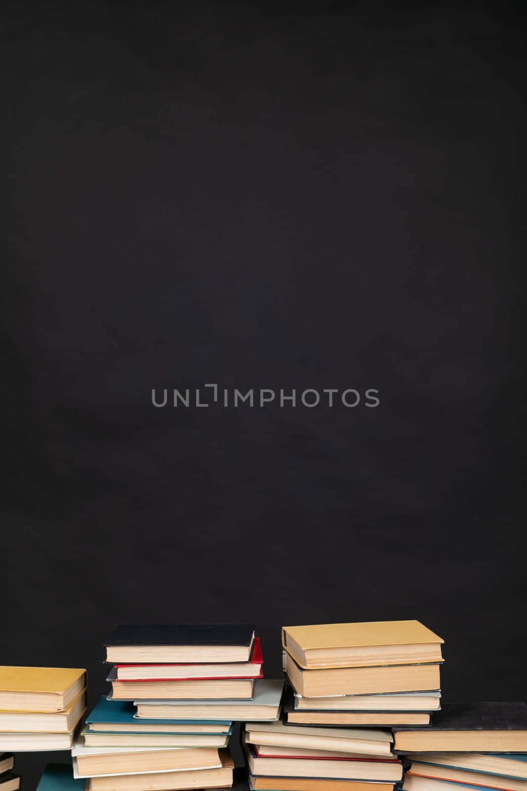 stack of books on a black background library