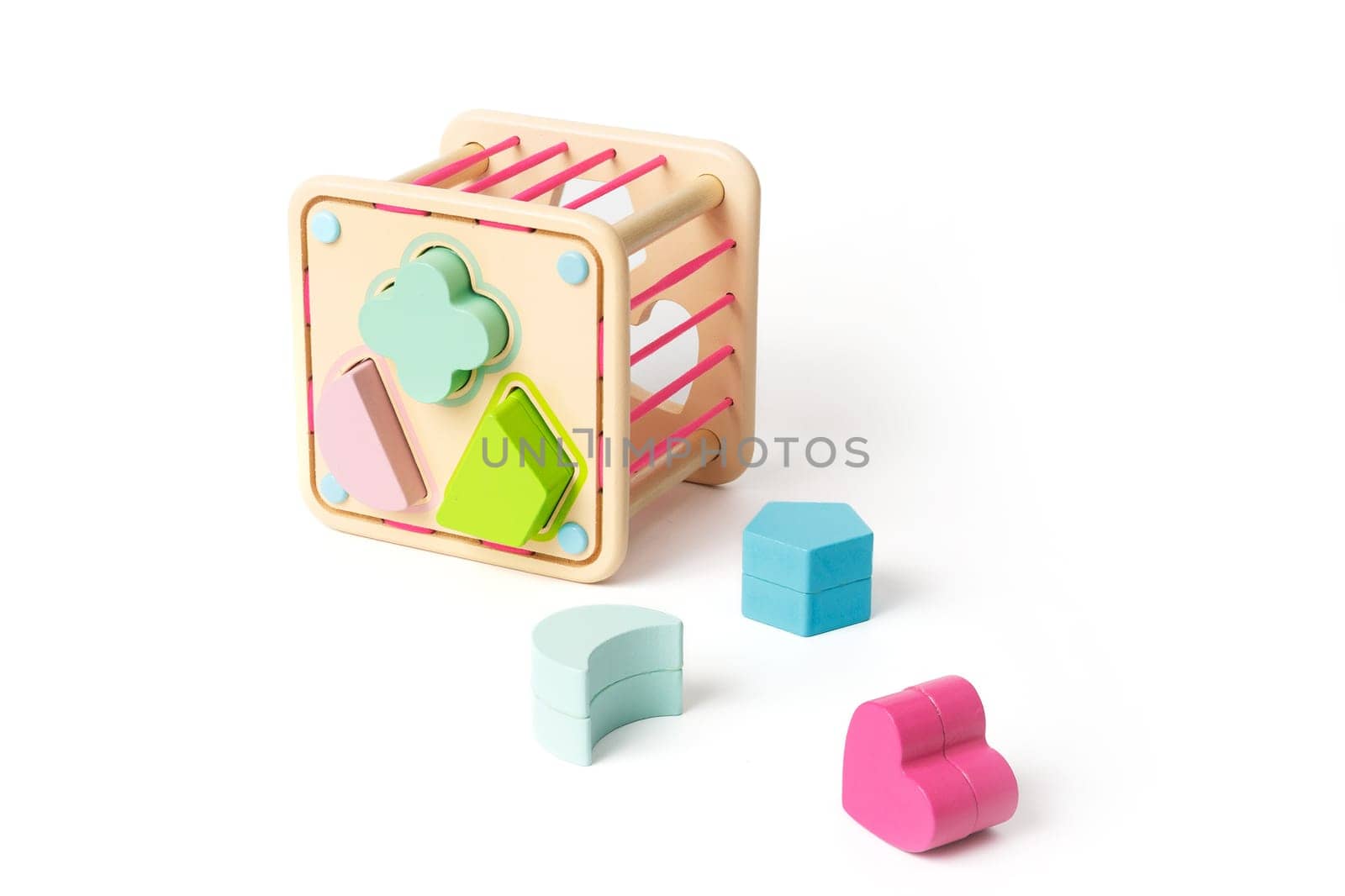 Wooden children's puzzle toy with colorful blocks of different shapes isolated on white background by Rom4ek