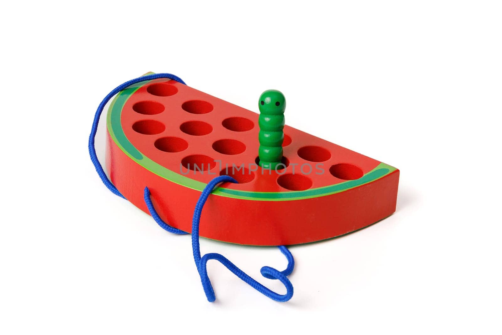 Kid's wooden Montessori toy in the shape of a red watermelon with a funny worm on a rope, toy for fine hand motor skills, isolated on white background by Rom4ek