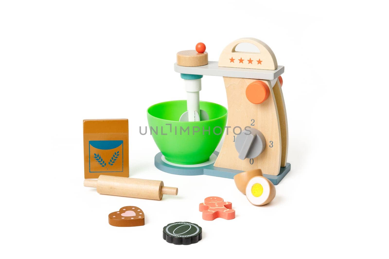 Toy kitchen set with mixer, flour, egg and rolling pin for baking plastic cookies, isolated on white background.