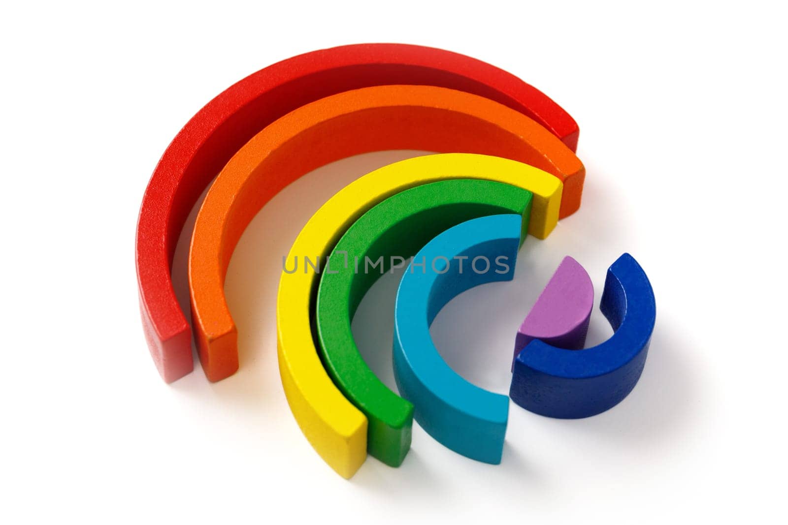 Children's wooden educational puzzle toy set in the form of a colorful rainbow isolated on white background by Rom4ek